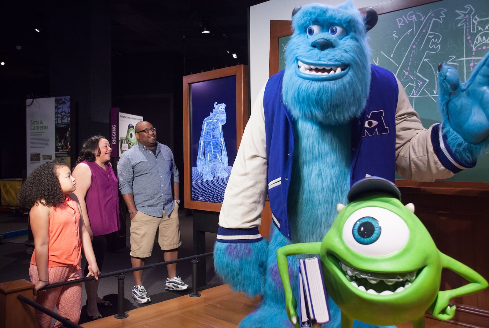 Visitors observe Mike and Sulley and watch how Sulley’s rig moves as he walks. CONTRIBUTED