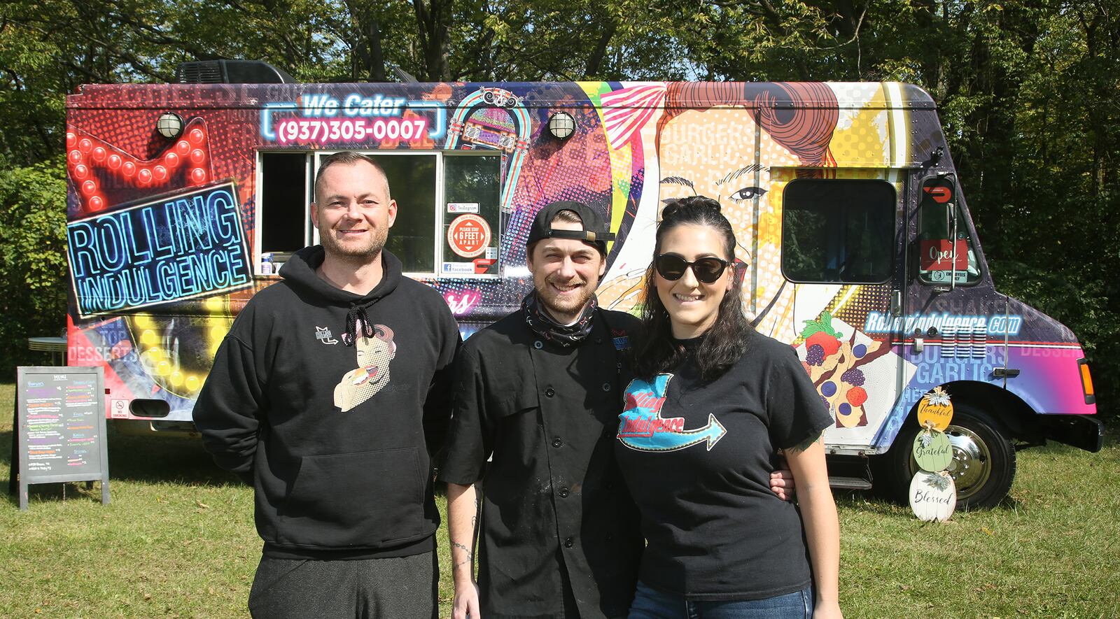 Travis Day, Drew Ballard and Jessica Sarra are the team behind the Rolling Indulgence food truck. LISA POWELL / STAFF