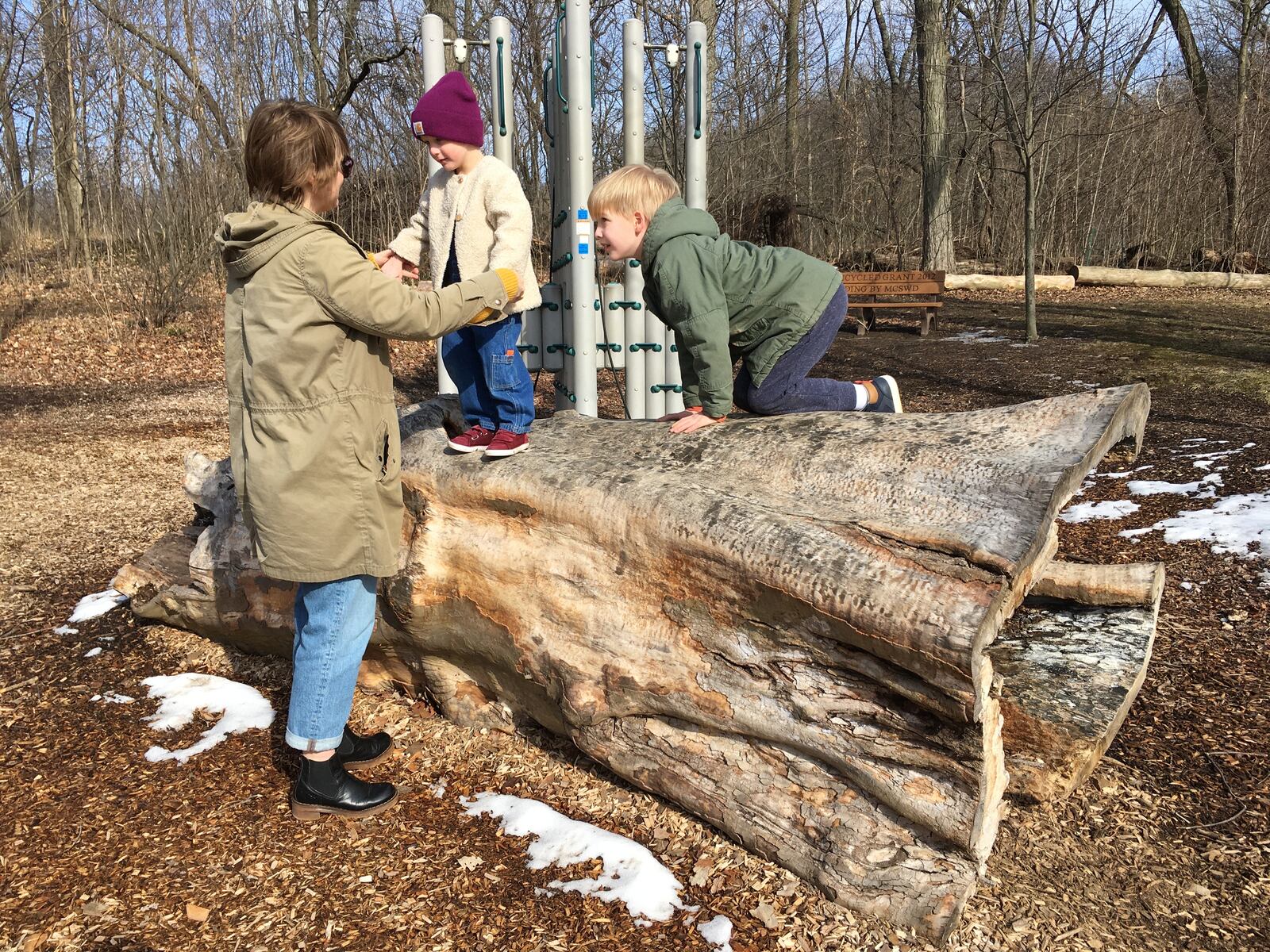 Kettering resident, Kasey Ohl, and her children Axel and Charlotte, play at the nature play area at Hills & Dales MetroPark . PHOTO CREDIT: Sarah Franks