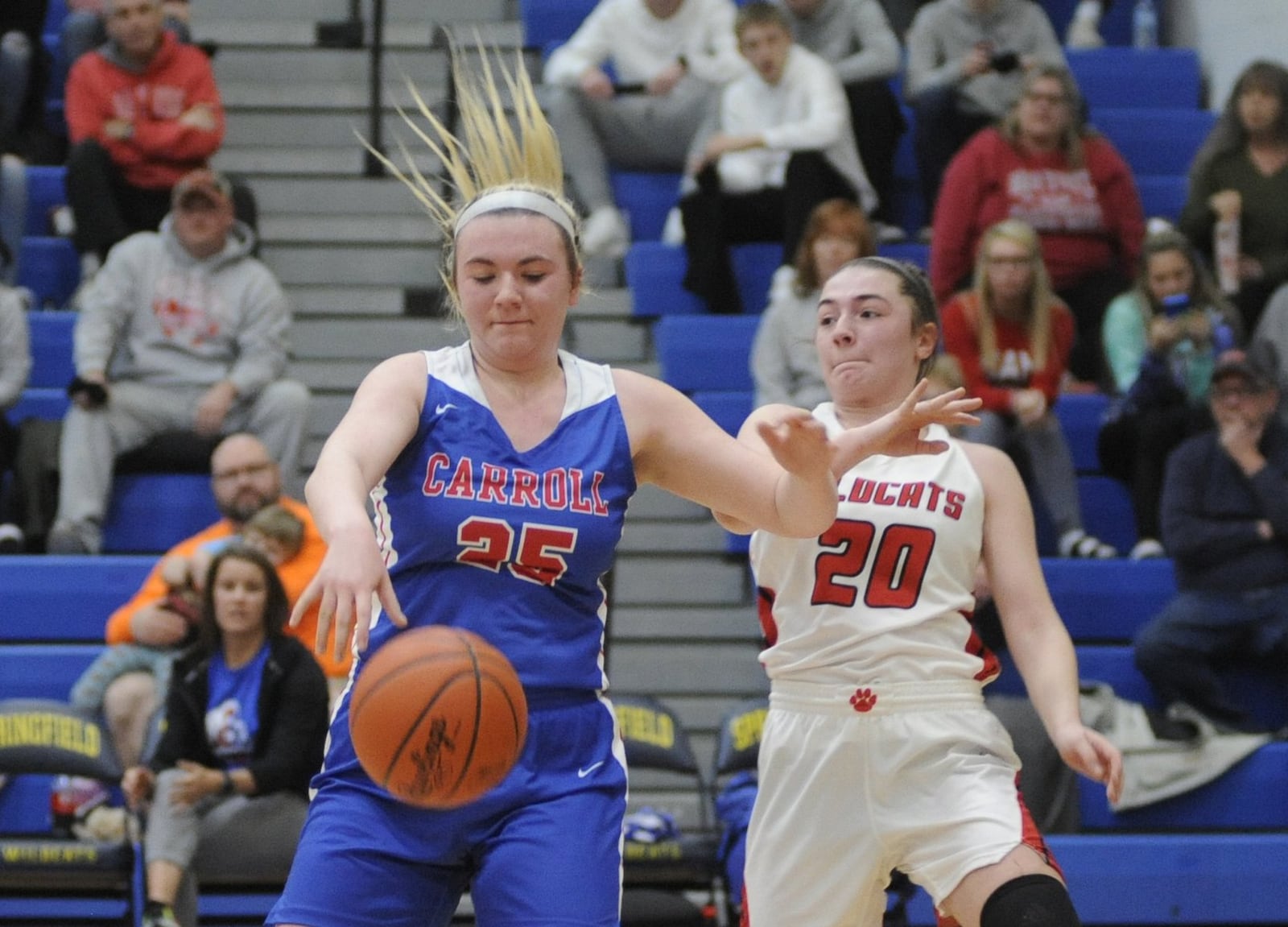 Megan Leraas of Carroll (left) beats Skyler Weir of Franklin to a rebound. Carroll defeated Franklin 57-43 in a girls high school basketball D-II regional final at Springfield High School on Friday, March 8, 2019. MARC PENDLETON / STAFF