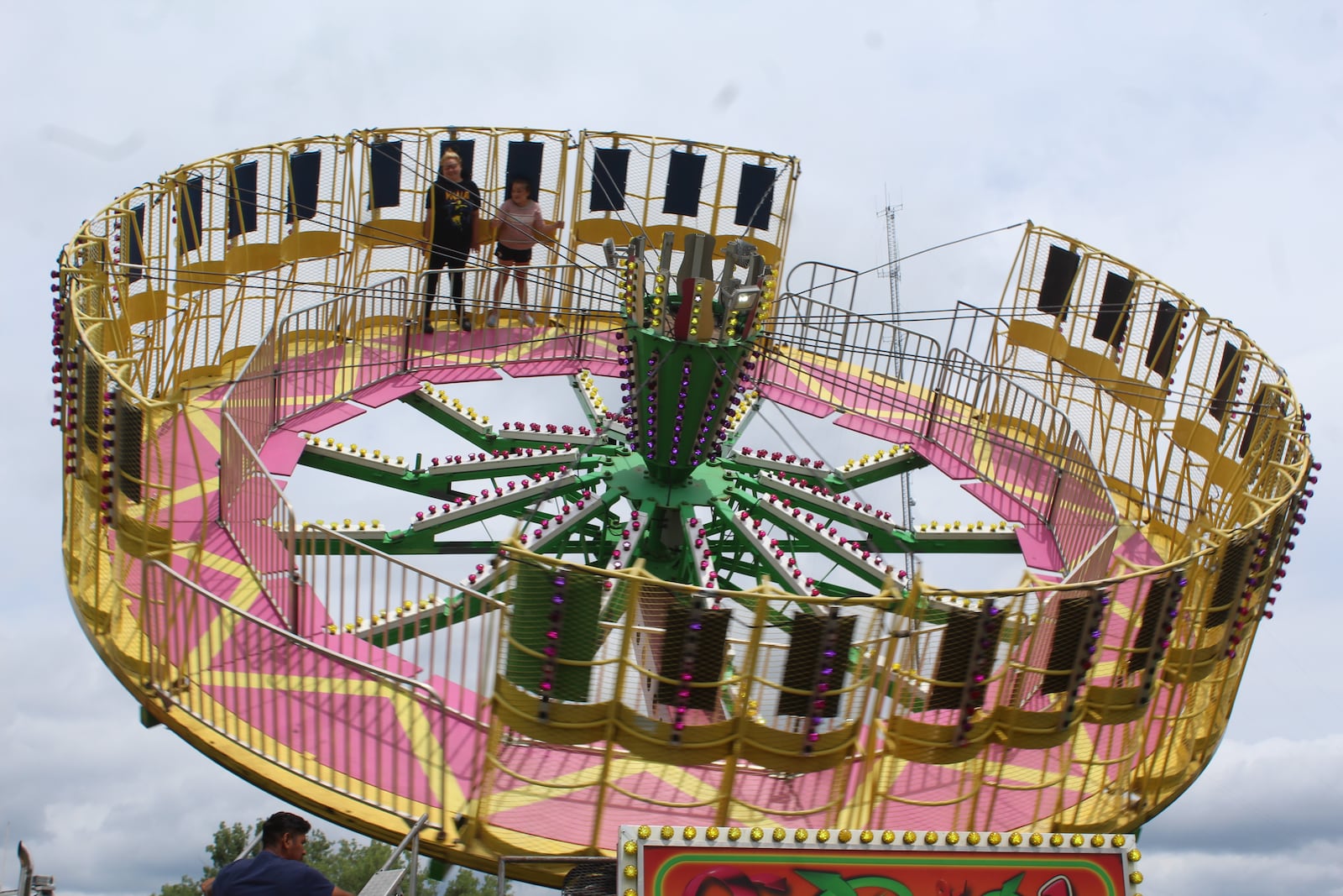 Shelbi Reffitt, 32, of Miamisburg, enjoys an amusement ride with her 11-year-old daughter, Ava Rich, at the Montgomery County Fair on Sunday, July 9, 2023. CORNELIUS FROLIK / STAFF
