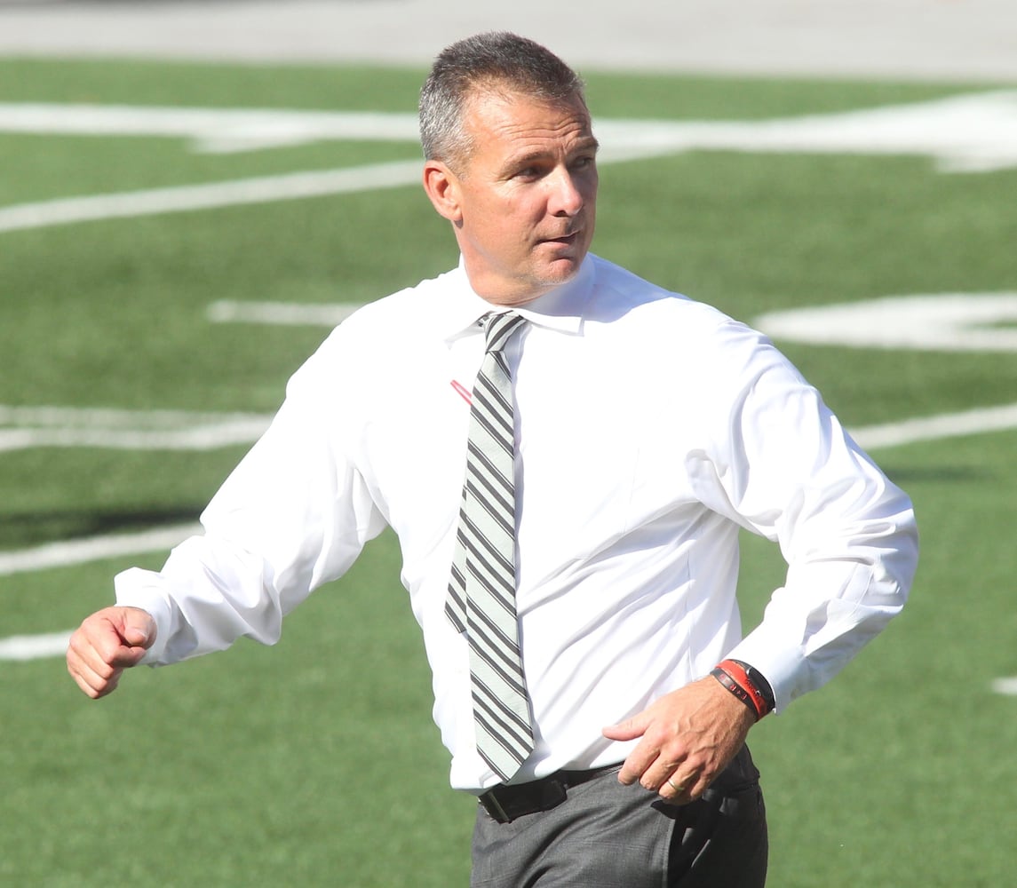 Photos: Urban Meyer jogs across field at Ohio Stadium