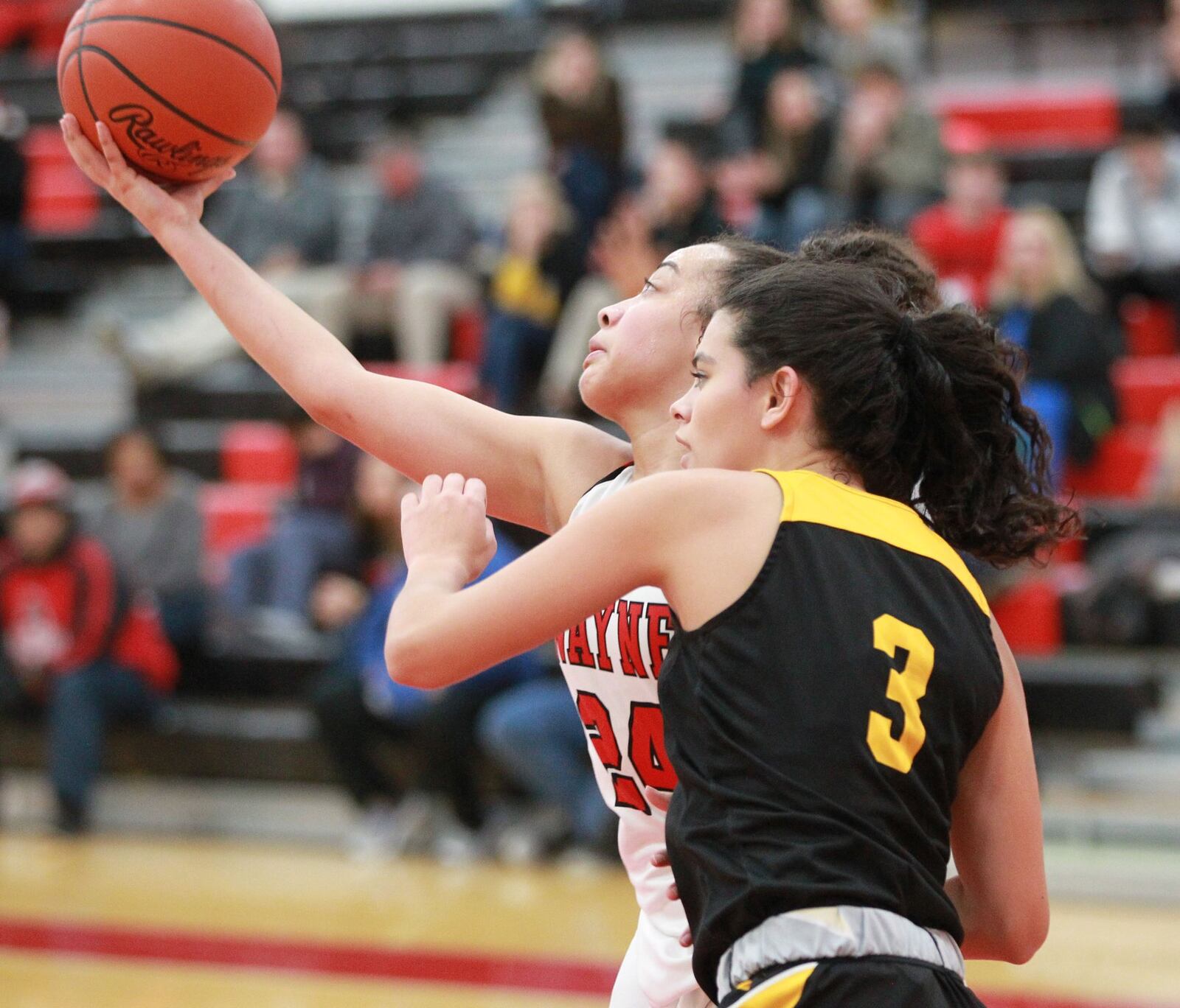 Jaida Wolfork of Wayne (left) helped limit Centerville leading scorer Amy Velasco to three points. Wayne defeated visiting Centerville 56-37 in a GWOC girls high school basketball game on Wednesday, Dec. 11, 2019. MARC PENDLETON / STAFF