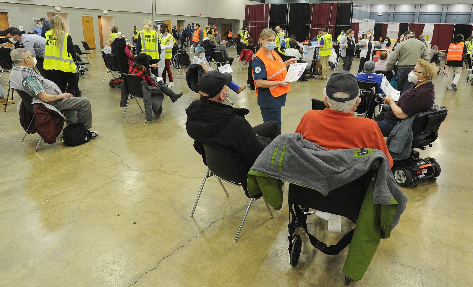 Hundreds of people arrived at the Dayton Convention Center Wednesday morning, Jan. 20, 2021, for the COVID-19 vaccination. MARSHALL GORBY\STAFF