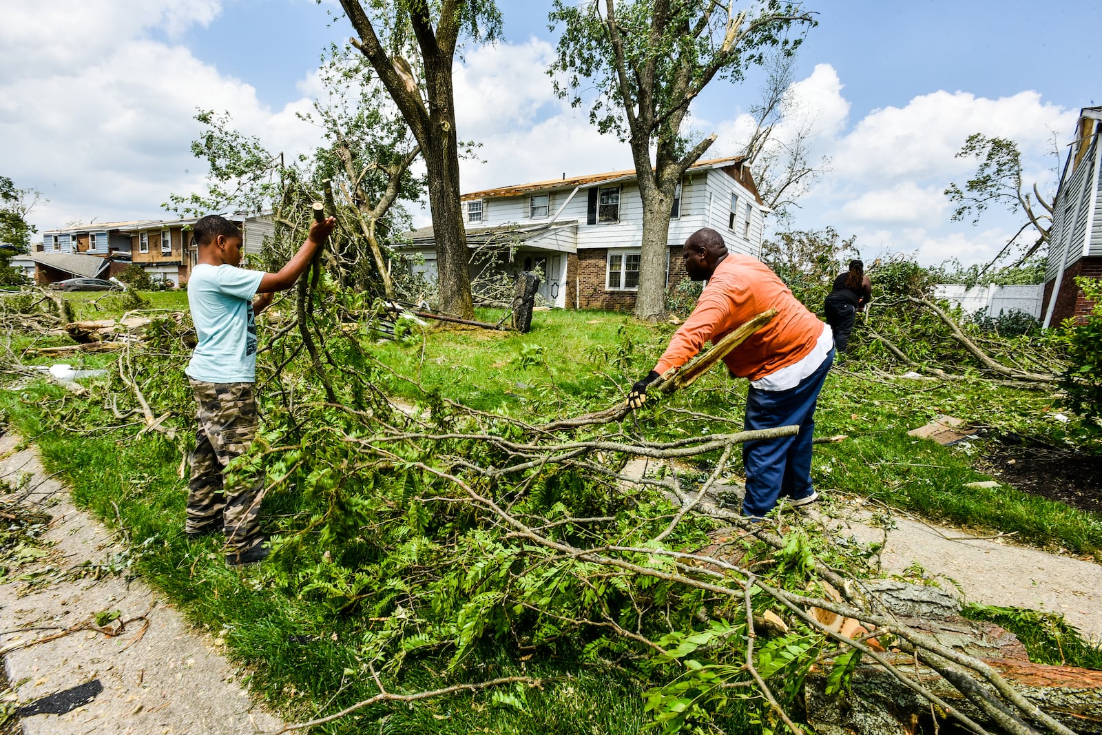 Houses and businesses in Trotwood were damage by tornadoes late Monday night, May 27. Many streets were blocked for downed trees, power lines and debris scattered through the neighborhoods. These homes were on Olive Tree Drive. NICK GRAHAM/STAFF