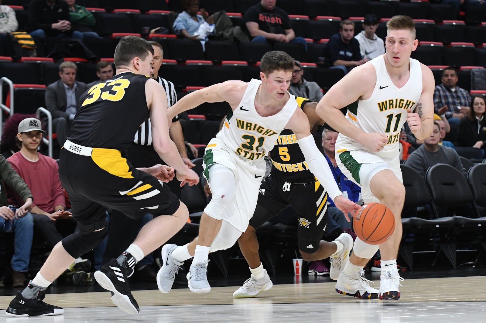 Wright State’s Cole Gentry (31) and Loudon Love (11) against Northern Kentucky’s Chris Vogt (33) during the Horizon League tournament championship game. Keith Cole/CONTRIBUTED