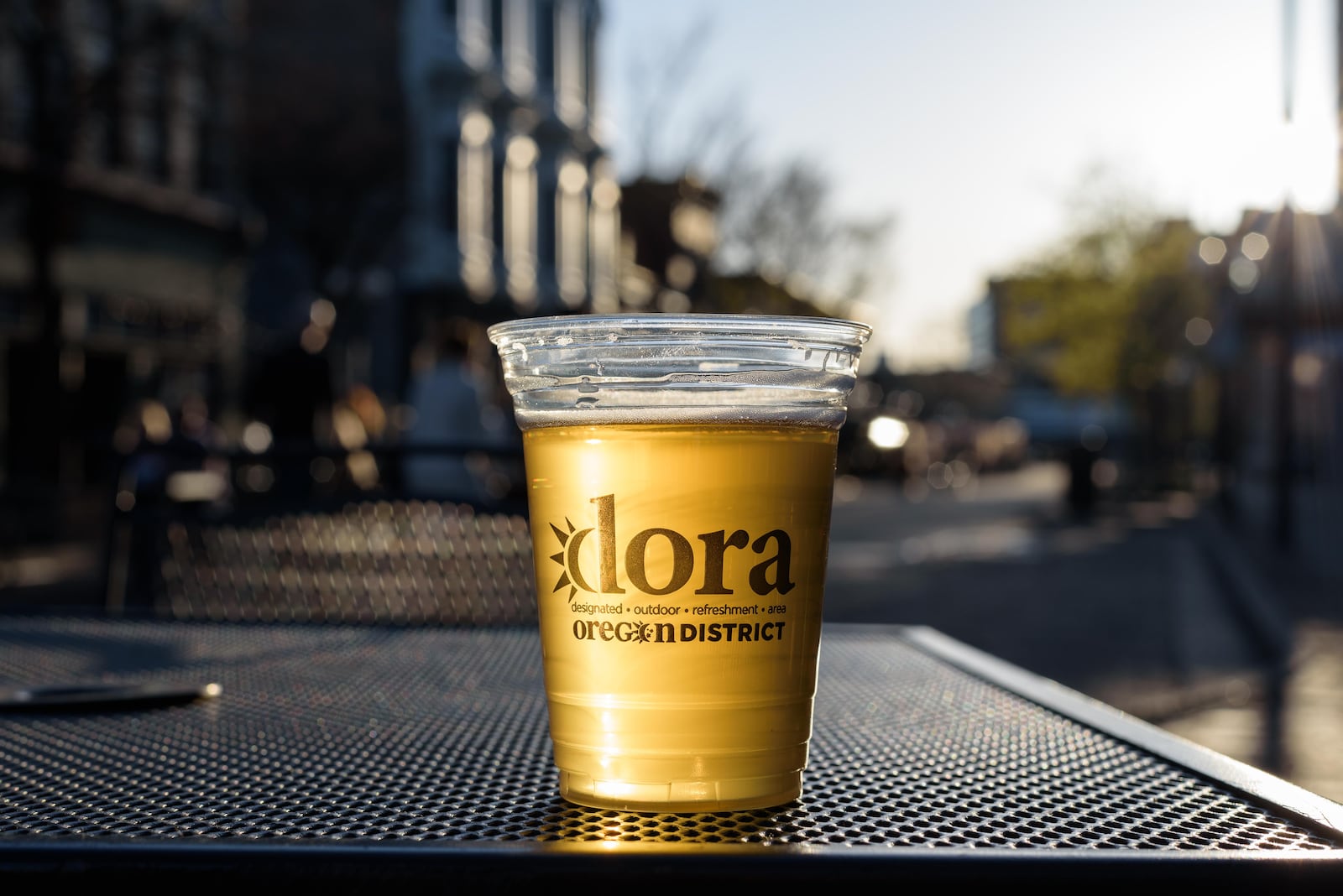 The Oregon District is a Designated Outdoor Refreshment Area (DORA) which allows guests 21+ to purchase an alcoholic beverage served in a branded cup and enjoy that beverage outdoors, within the designated area. TOM GILLIAM/CONTRIBUTING PHOTOGRAPHER