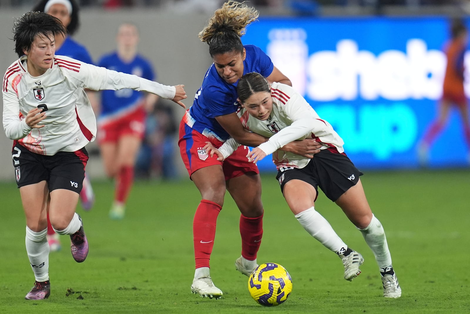 Japan midfielder Fuka Nagano, right, battles United States forward Catarina Macario for a ball during the first half of a SheBelieves Cup women's soccer tournament match Wednesday, Feb. 26, 2025, in San Diego. (AP Photo/Gregory Bull)