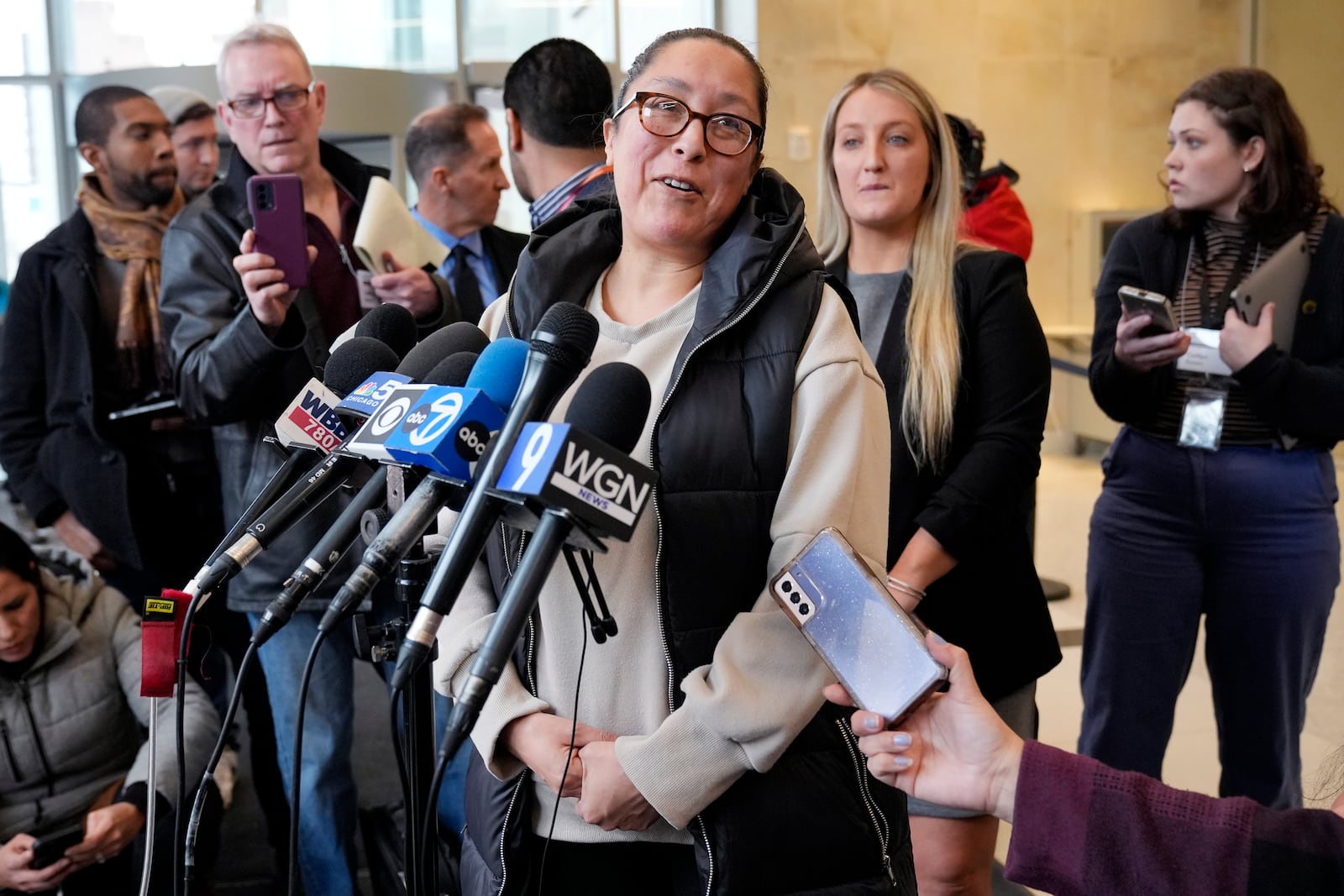 Highland Park parade survivor Ashbey Beasley smiles as she talks to reporters after Robert E. Crimo III pleaded guilty to the Highland Park parade shooting at the Lake County Courthouse in Waukegan, Ill., Monday, March 3, 2025. (AP Photo/Nam Y. Huh, Pool)