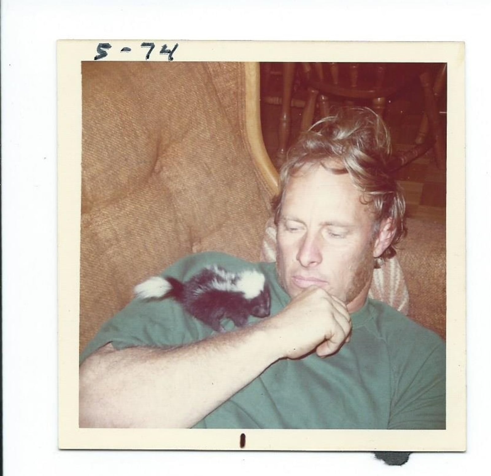 Howard Millican and the real baby skunk he named Trouble. CONTRIBUTED