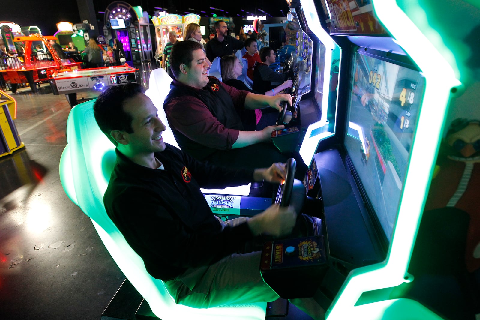 Jonah Sandler (foreground) is the CEO and Stevie Baia (rear) is general manager of Scene 75 Entertainment Center in Vandalia. LISA POWELL / STAFF