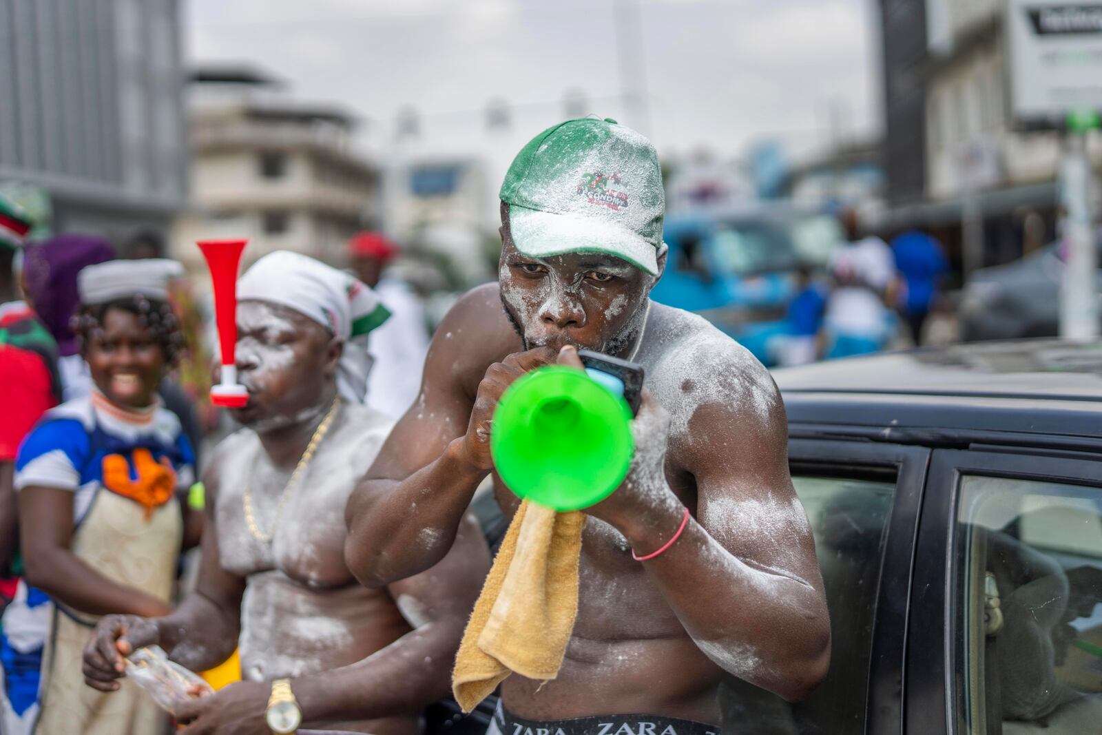 Supporters of opposition candidate and former President John Dramani Mahama celebrate his victory after his opponent Ghana’s vice president and ruling party candidate, Mahamudu Bawumia conceded in Accra, Ghana, Sunday, Dec. 8, 2024. (AP Photo/Jerome Delay)