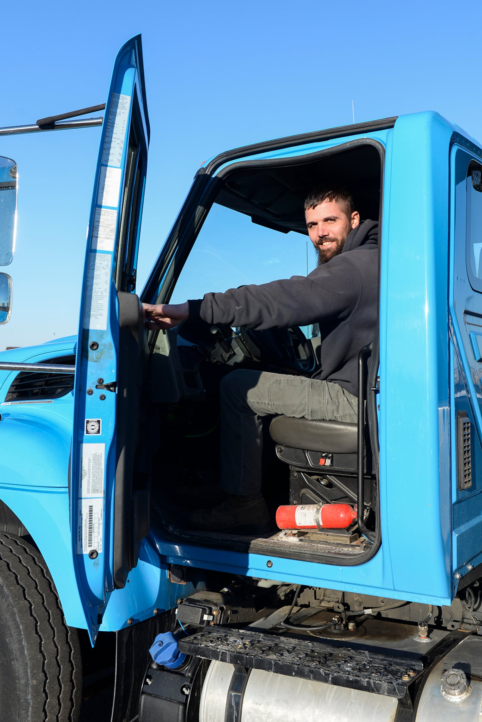 Jeff Hart, an 88th Civil Engineer Squadron tractor operator, climbs into his snowplow Feb. 23 at Wright-Patterson Air Force Base. U.S. AIR FORCE PHOTO/WESLEY FARNSWORTH