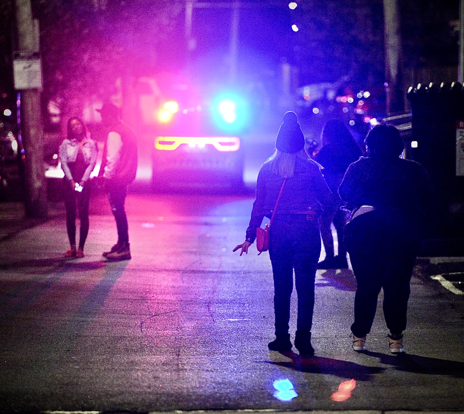 University of Dayton and Dayton Police keep a close eye on crowds of students Saturday night, March 16, 2024. MARSHALL GORBY \STAFF