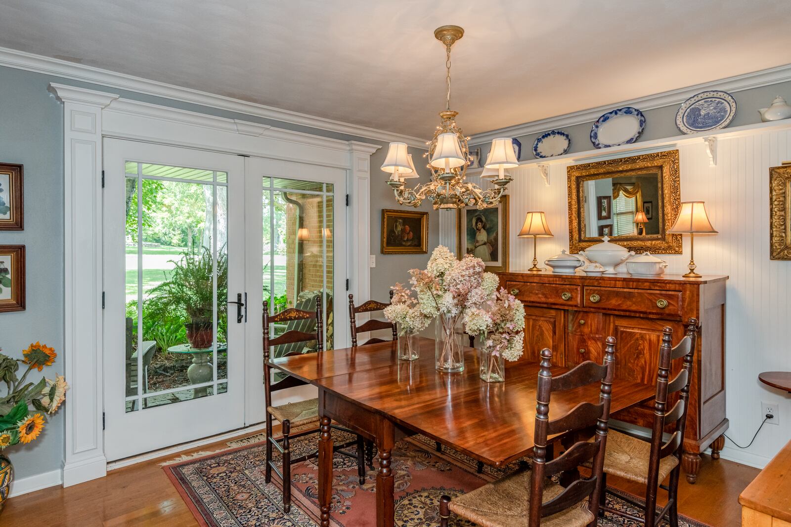 The gardens provide ample opportunity for creating beautiful dried floral arrangements, as seen here in the Vellas' dining room. Contributed