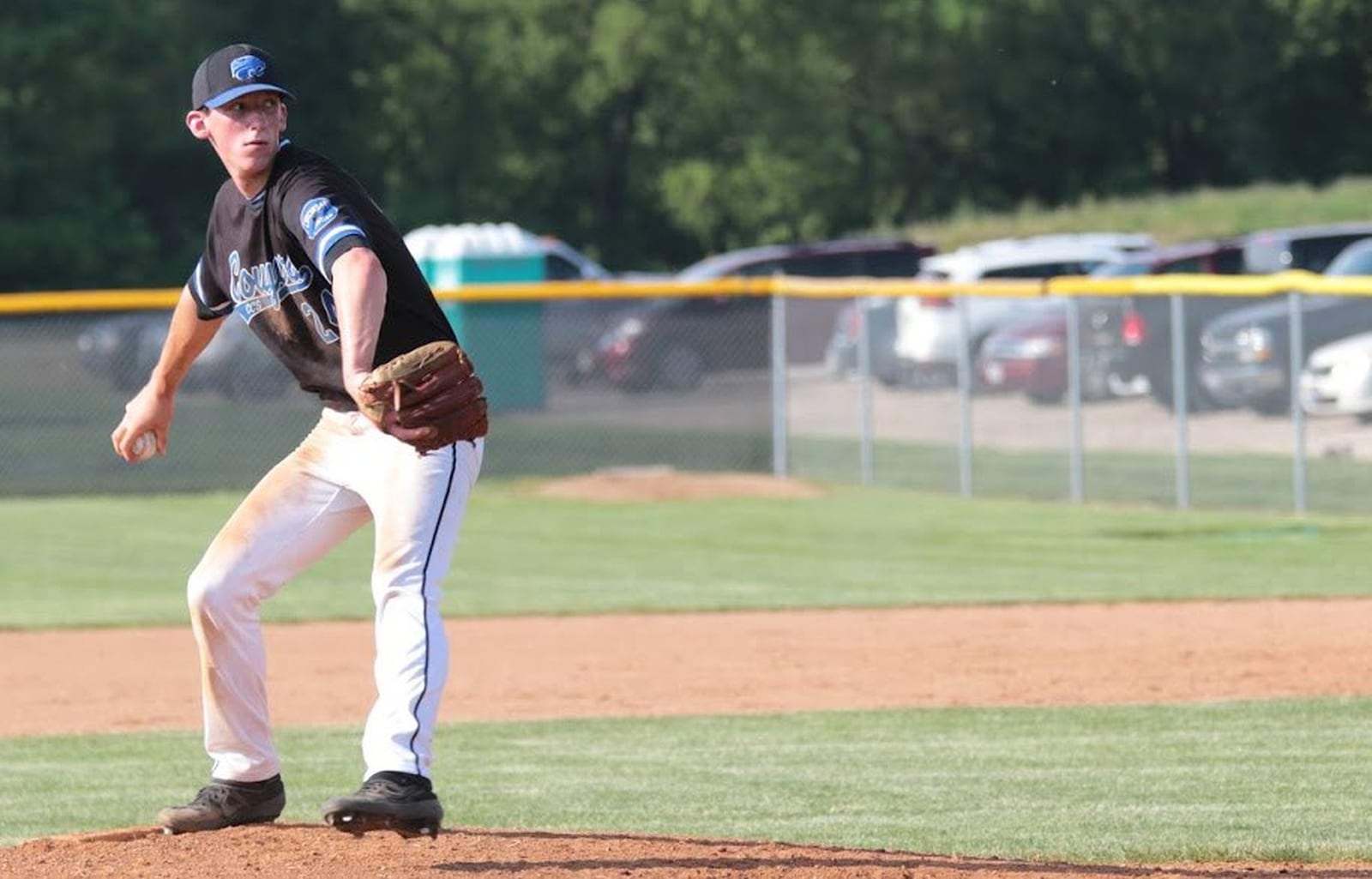 Cincinnati Christian pitcher Mitchell Smith is about to deal to the plate Friday during the Cougars’ 3-1 win over Tri-County North in a Division IV district baseball final at Carlisle. PHOTO BY KRAE/WWW.KRAEPHOTOGRAPHY.COM