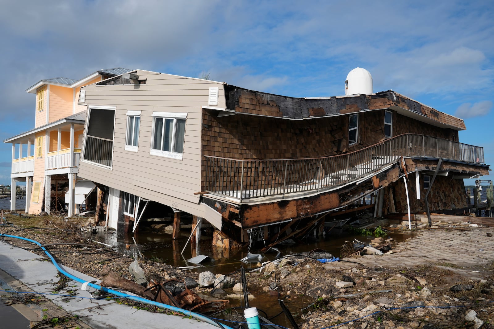 Houses lie in ruins after sustaining tornado and flood damage from Hurricane Milton, Thursday, Oct. 10, 2024, in Matlacha, Fla. (AP Photo/Marta Lavandier)