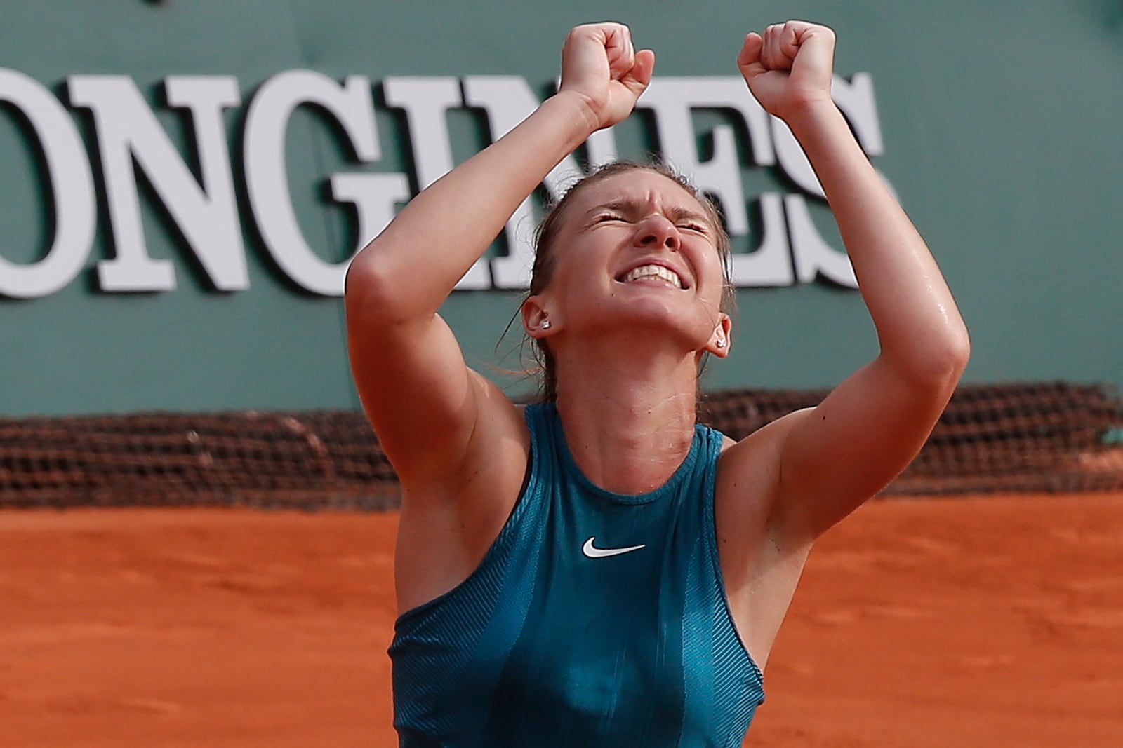 FILE - Romania's Simona Halep celebrates wining the final match of the French Open tennis tournament against Sloane Stephens of the U.S. in three sets at the Roland Garros stadium in Paris, France, June 9, 2018. (AP Photo/Michel Euler, file)