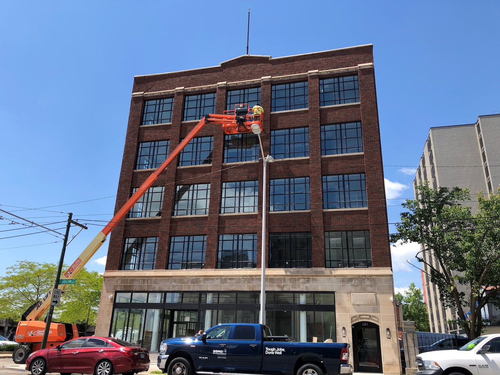 Work continues on the exterior of the Graphic Arts Lofts building on South Ludlow Street in downtown Dayton. CORNELIUS FROLIK / STAFF