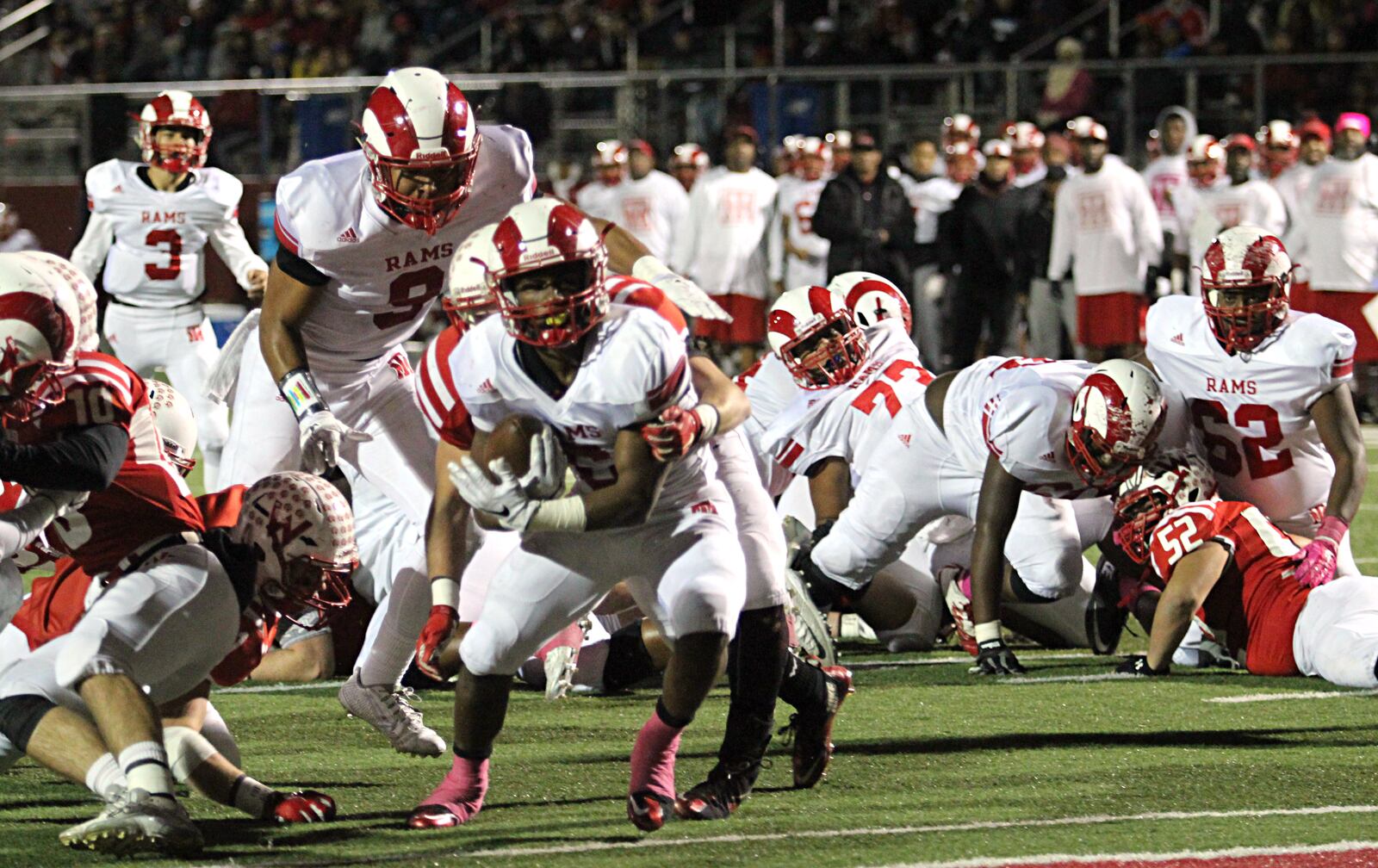 Trotwood's Raveion Hargrove breaks a tackle to score a touchdown in a 2015 Division III, Region 10 championship game Friday in Lima. GREG BILLING / STAFF