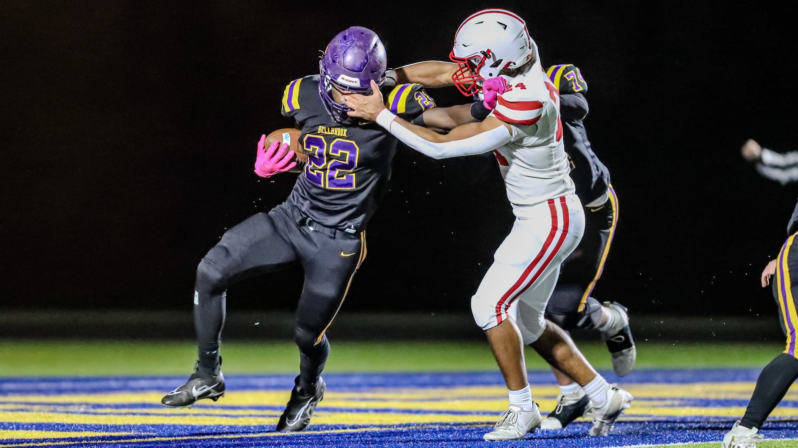 Bellbrook High School junior Gage Cameron is tackled by London's Ladainan McNeal during their game on Friday night at Springfield High School. The Red Raiders won 13-0. CONTRIBUTED PHOTO BY MICHAEL COOPER