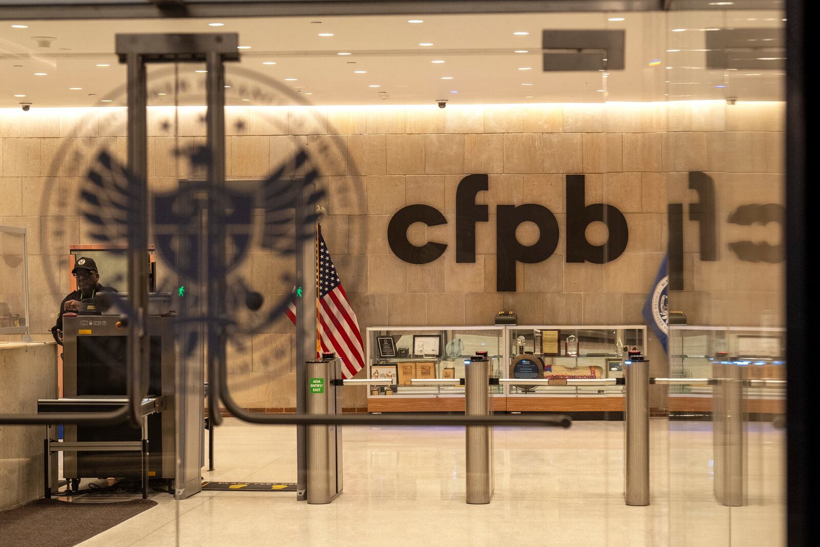 A security officer works inside of the Consumer Financial Protection Bureau (CFPB) building headquarters Monday, Feb. 10, 2025, in Washington. (AP Photo/Jacquelyn Martin)