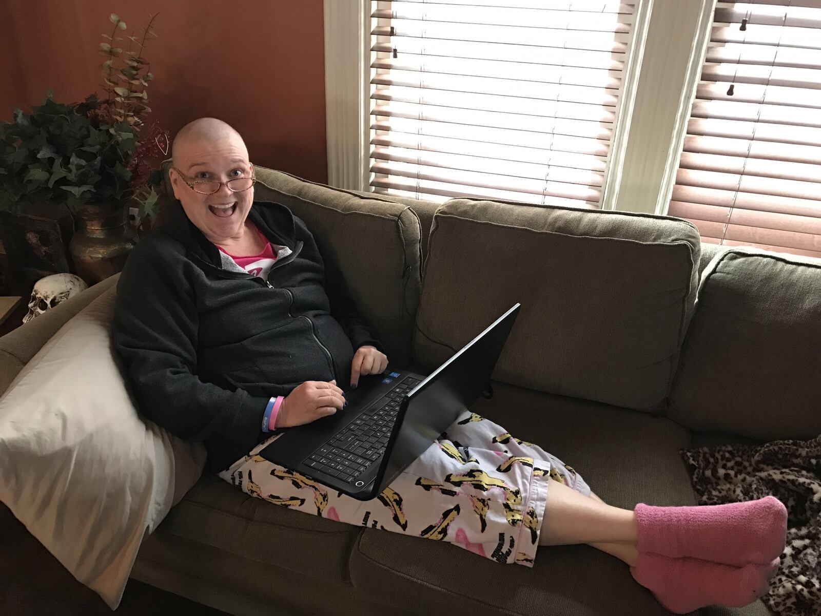 Kristen Wicker relaxes at home in Dayton during her cancer treatment. CONTRIBUTED