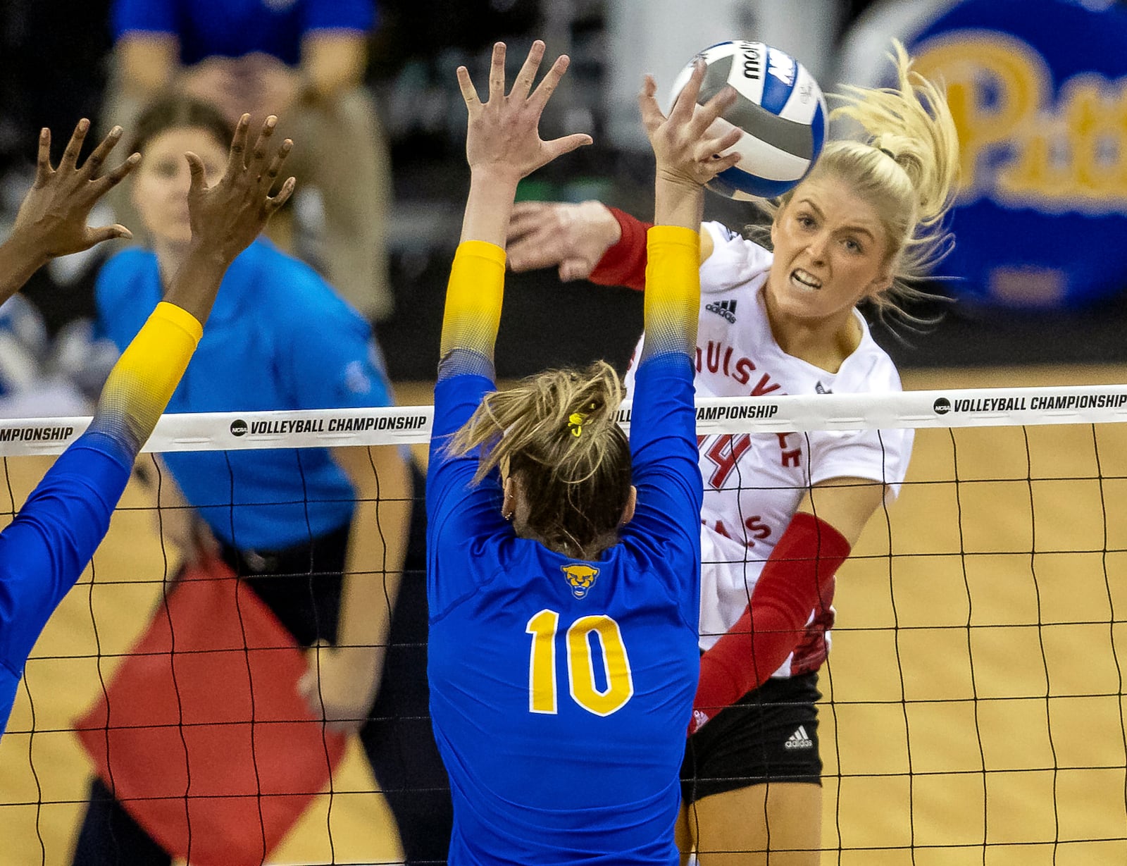 FILE - Louisville's Anna DeBeer, right, spikes the ball against Pittsburgh's Rachel Fairbanks (10) in the third set during the semifinals of the NCAA volleyball tournament Dec. 15, 2022, in Omaha, Neb. (AP Photo/John S. Peterson, File)