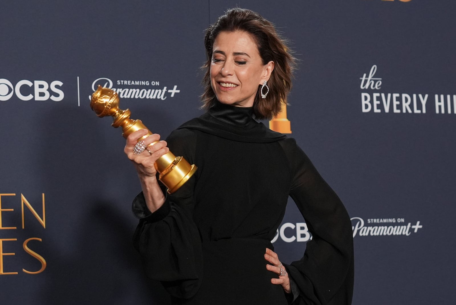 Fernanda Torres poses in the press room with the award for best performance by a female actor in a motion picture - drama for "I'm Still Here" during the 82nd Golden Globes on Sunday, Jan. 5, 2025, at the Beverly Hilton in Beverly Hills, Calif. (AP Photo/Chris Pizzello)