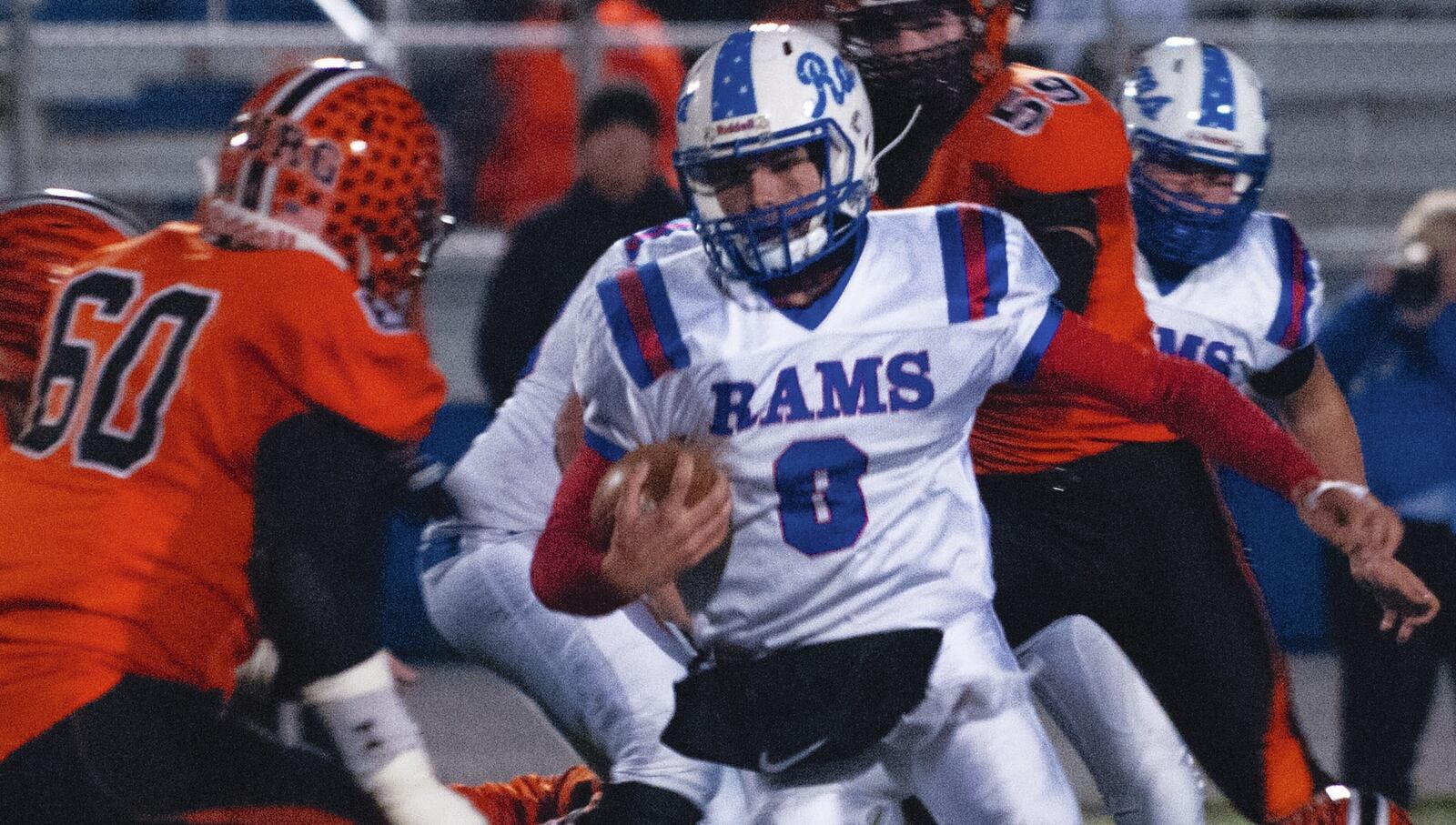 Wheelersburg linebacker Evan Dahm (60) eyes Jamestown Greeneview quarterback Nick Clevenger during a run in last Saturday’s Division V, Region 20 playoff semifinal in Chillicothe. Wheelersburg won 35-13. CONTRIBUTED PHOTO BY JEFF GILBERT