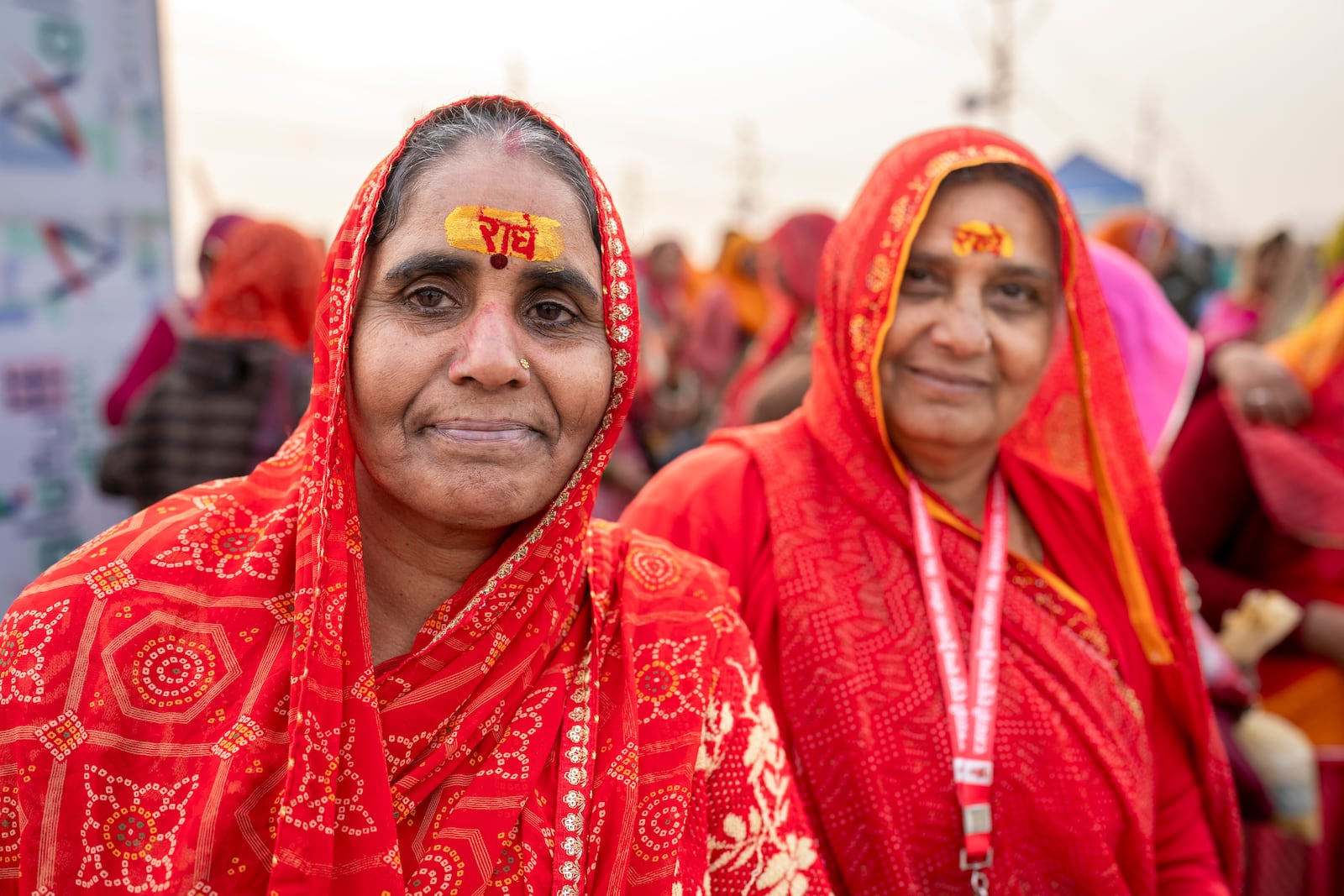 Hindu devotees have sacred marks reading 'Radhe' on their foreheads at the confluence of the Ganges, the Yamuna, and the Saraswati rivers during the 45-day-long Maha Kumbh festival in Prayagraj, India, Tuesday, Jan. 14, 2025. (AP Photo/Ashwini Bhatia)