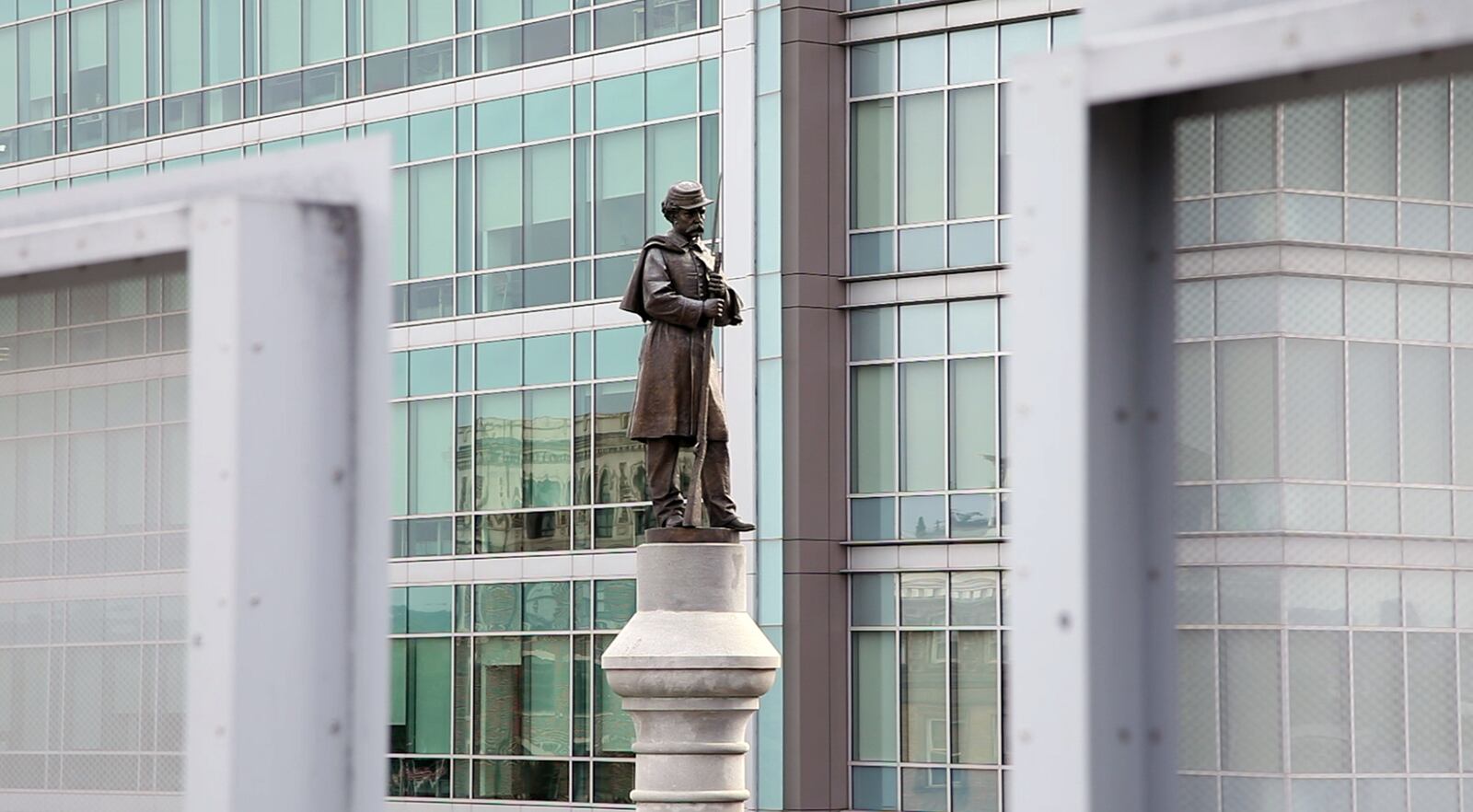 This Civil War Soldiers Monument is located on Main Street in downtown Dayton and includes a bronze reproduction of originally marble sculpted Pvt. Geroge Washington Fair.   TY GREENLEES / STAFF