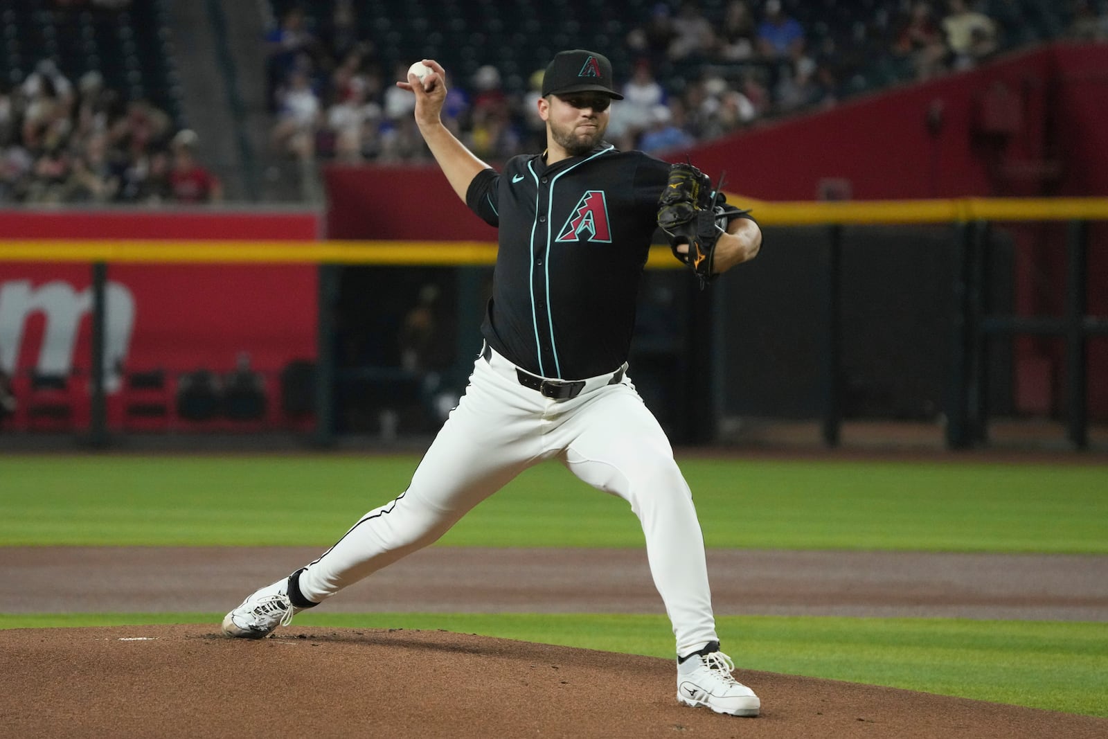 FILE - Arizona Diamondbacks pitcher Slade Cecconi (43) throws against the Atlanta Braves in the first inning during a baseball game, July 10, 2024, in Phoenix. (AP Photo/Rick Scuteri, File)