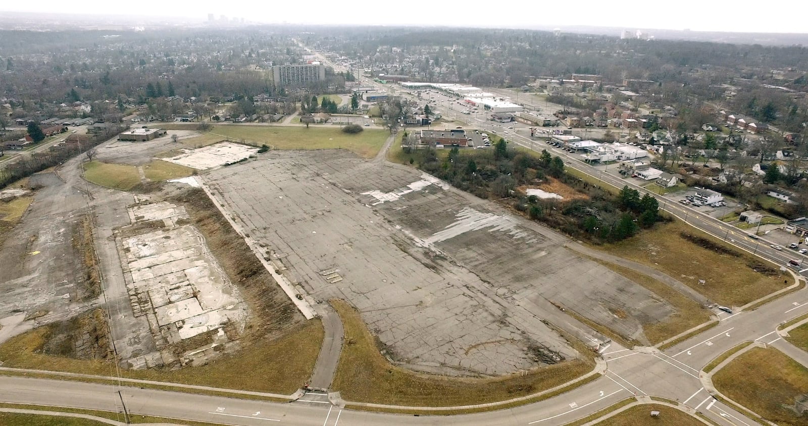 Outlines of retail building foundations and a parking lot are all that remains of the Forest Park shopping center on North Main Street in Harrison Township.  County Corp, in partnership with Harrison Township and Montgomery County will facilitate thefirst public meeting to initiate feedback on the Forest Park Area Plan on Monday, January 29th at Horizon Science Academy.   TY GREENLEES / STAFF