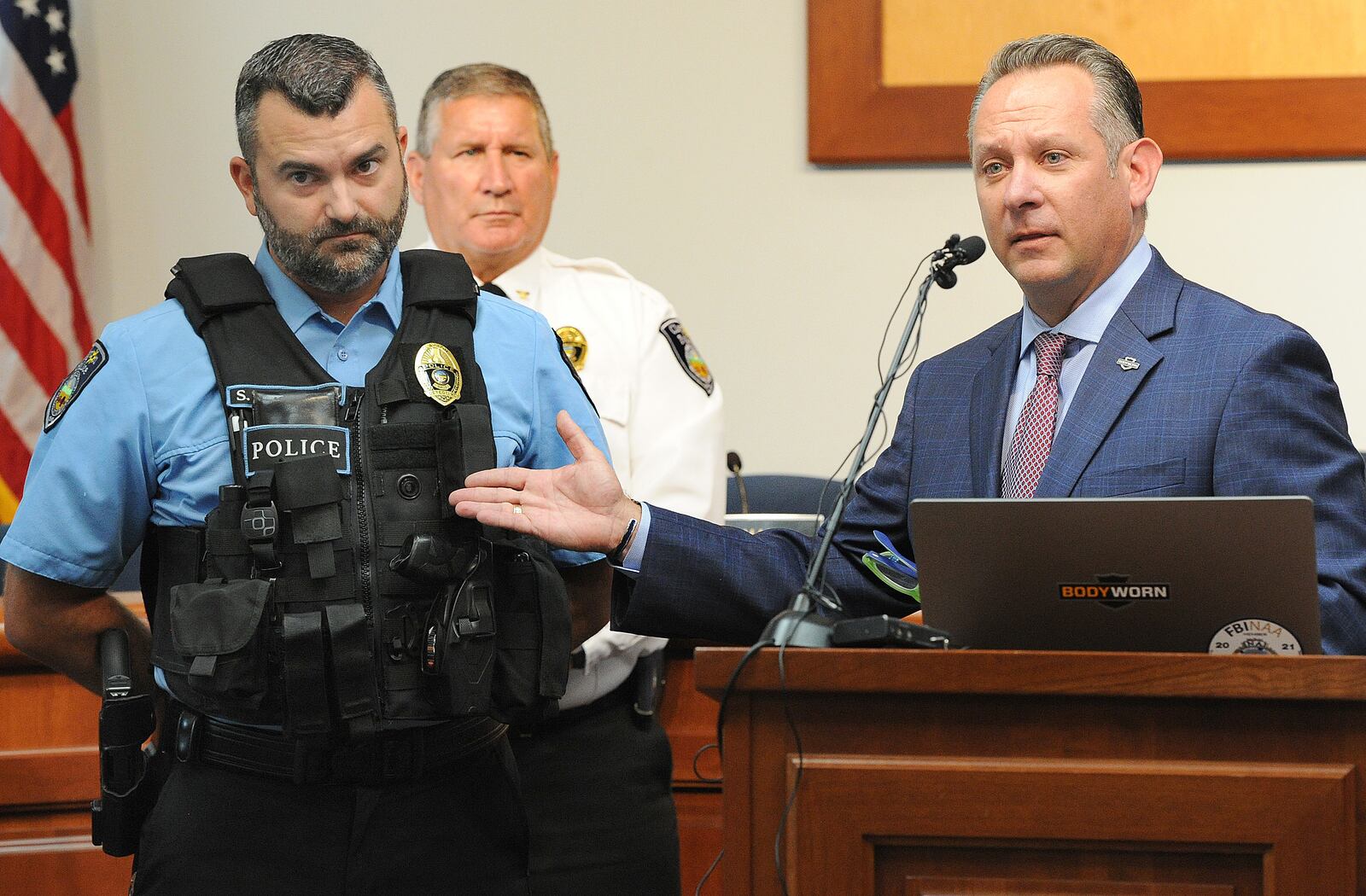 Utility Inc. BodyWorn Director of Law Enforcement Relations Jason Dombkowski points at Clayton Police Detective Shawn Schutte as he displays the new body worn cameras Clayton Police have started wearing. Clayton Police Chief Matthew Hamlin, who is standing behind him, said the body cameras will be worn by his officers while they are on duty. MARSHALL GORBY\STAFF