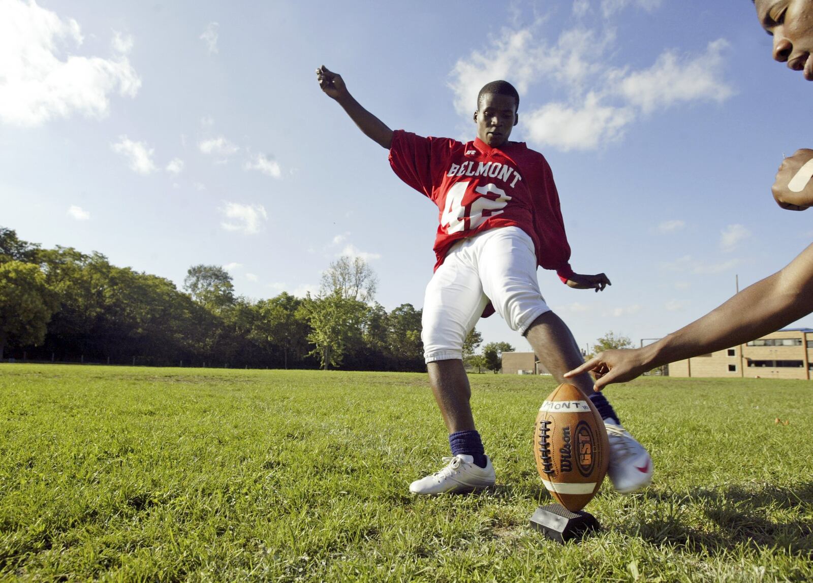 Ramadhan Ndayisaba, born in Burundi, Africa, is now the kicker for the Belmont High School football team. Ndayisaba, lived in the Congo and Tanzania, is now a Daytonian helping Belmont score against their competitors. FILE PHOTO