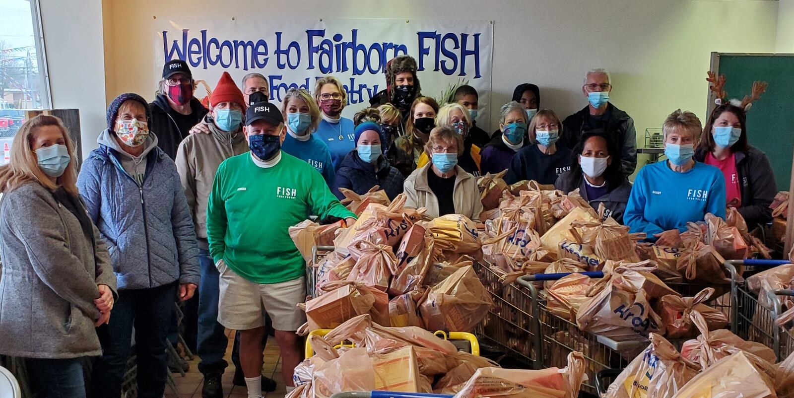 Fairborn FISH volunteers gather to give out Thanksgiving meals in November. CONTRIBUTED