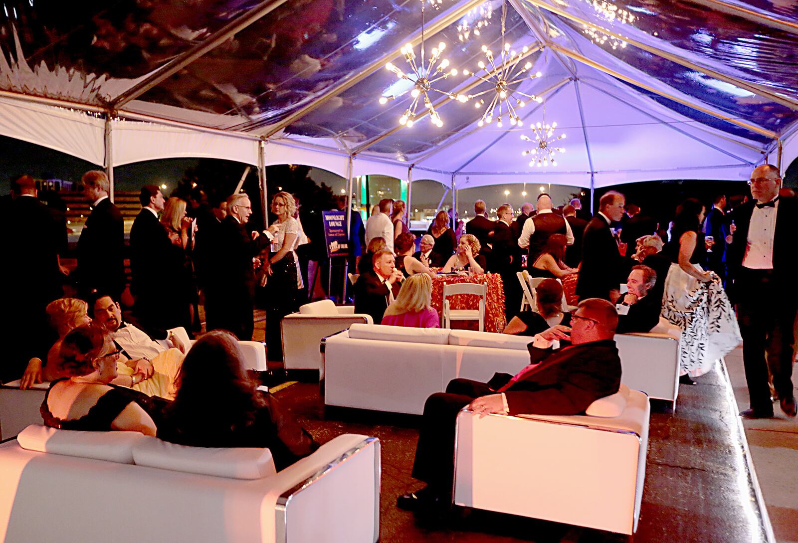 Guests enjoy the evening in an outdoor area at the 61st annual Dayton Art Institute Art Ball held June 8, 2018. E.L. HUBBARD / CONTRIBUTING PHOTOGRAPHER