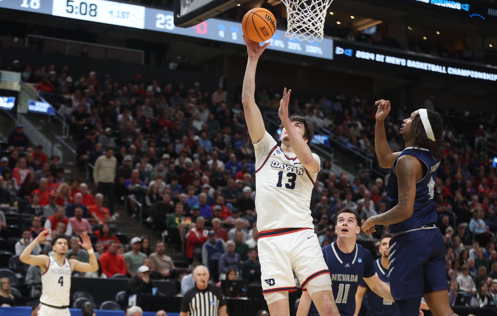 Dayton's Isaac Jack scores in the first half against Nevada in the first round of the NCAA tournament on Thursday, March 21, 2024, at the Delta Center in Salt Lake City, Utah. David Jablonski/Staff