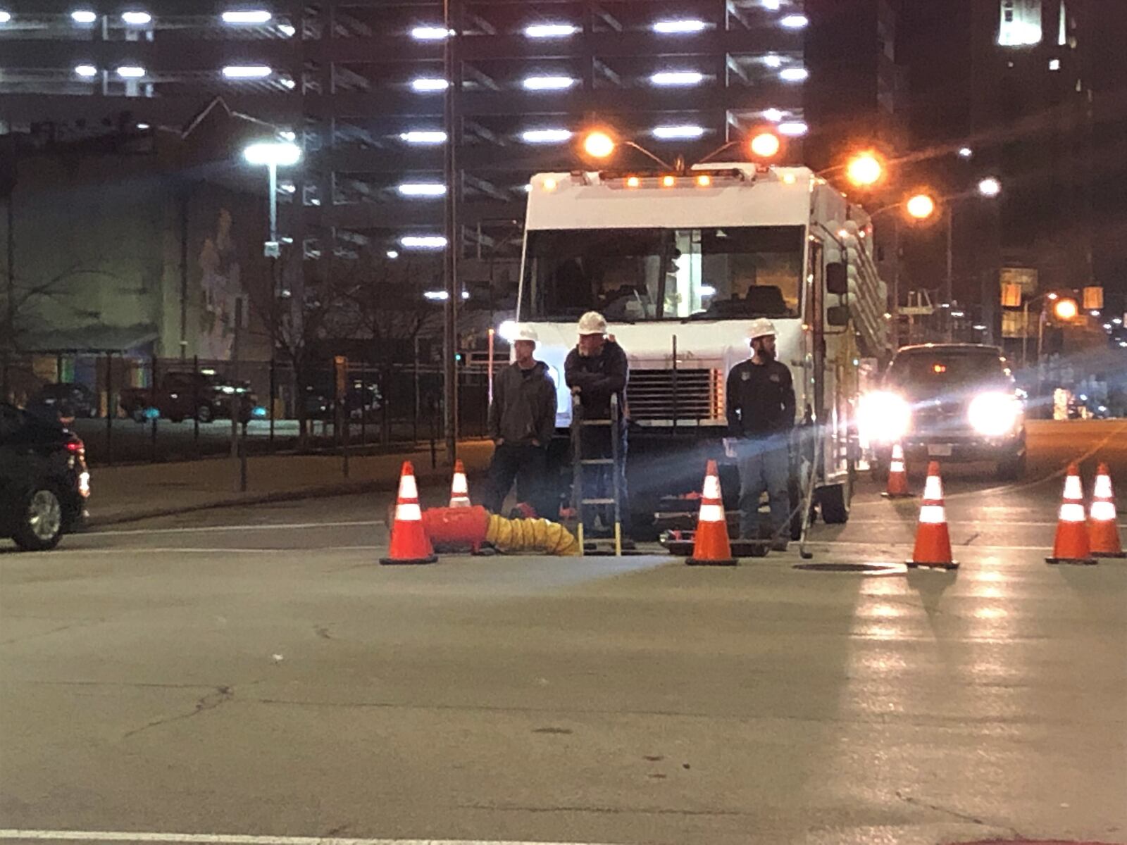 AES employees work on West Second Street in downtown Dayton. CORNELIUS FROLIK / STAFF