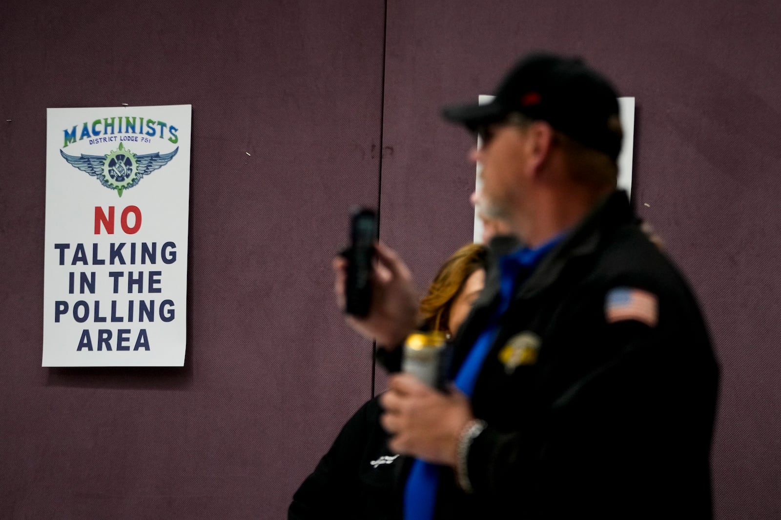 Union members watch as volunteers tally votes on a new contract offer from Boeing, Wednesday, Oct. 23, 2024, at Seattle Union Hall in Seattle. (AP Photo/Lindsey Wasson)