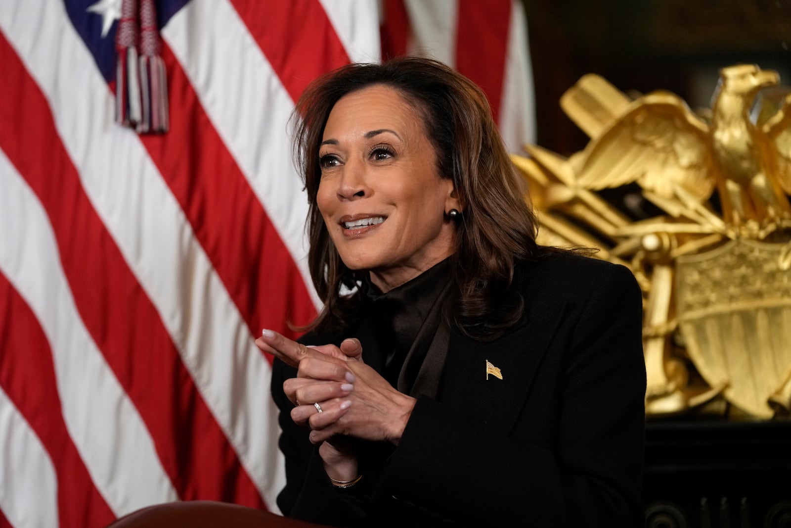 Vice President Kamala Harris speaks before signing the desk drawer in her ceremonial office, a long-standing tradition for Vice Presidents, in the Eisenhower Executive Office Building on the White House complex in Washington, Thursday, Jan. 16, 2025. (AP Photo/Susan Walsh)