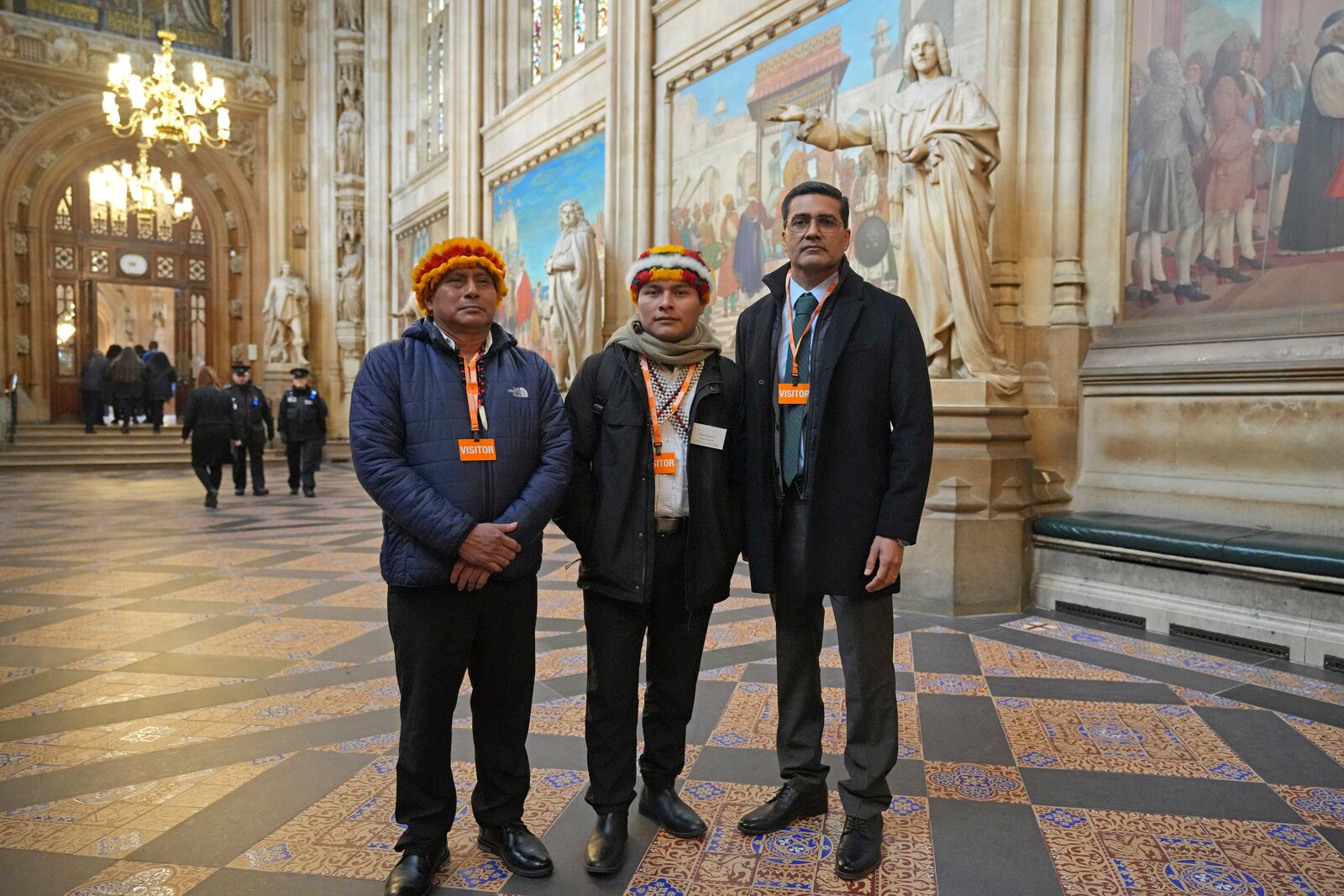 Indigenous leaders from the Wampis Nation in Peru, from left, Pamuk Teofilo Kukush Pati, Tsanim Evaristo Wajai Asamat and Jesus Javier Thomas Gonzalez, from Mexico, pose in St. Stephen's Hall in London, Thursday, Nov. 21, 2024. (AP Photo/Kin Cheung)