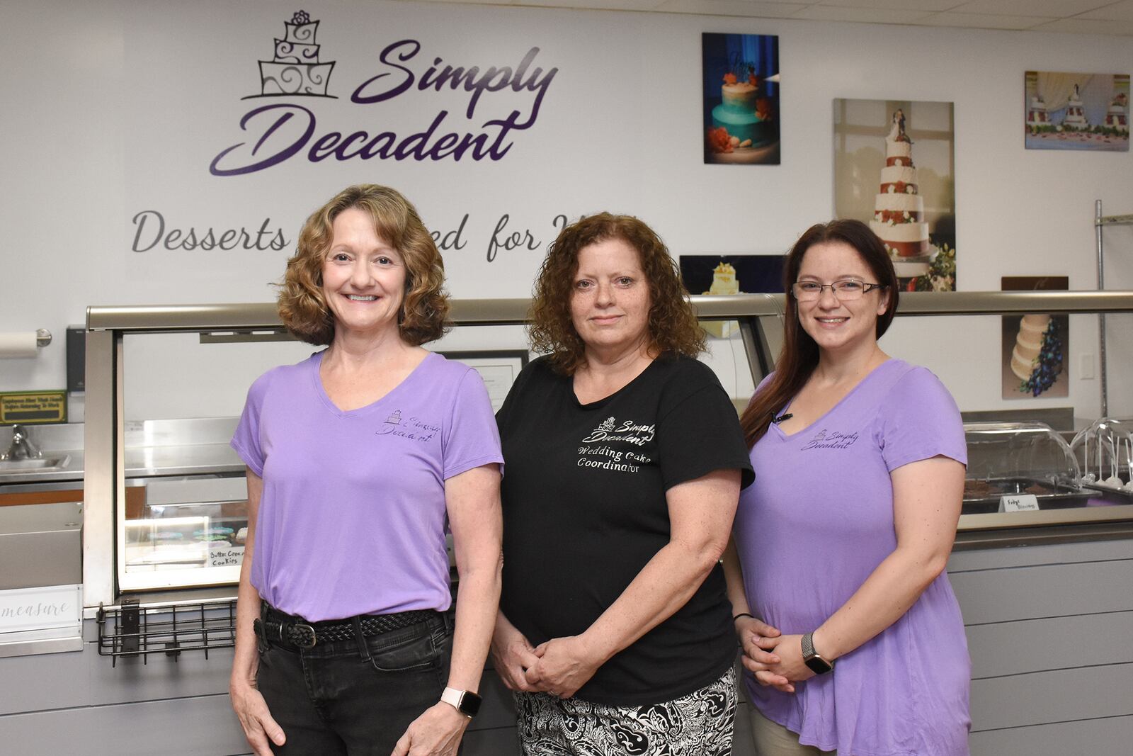 Simply Decadent, a Bellbrook bakery known for its wedding cakes, special occasion cakes and desserts, has relocated to 137 W. Franklin St. Pictured (left to right) are co-owners Debby Fuller, Adonica Collins-Smith and Jackie Fuller (CONTRIBUTED PHOTO).