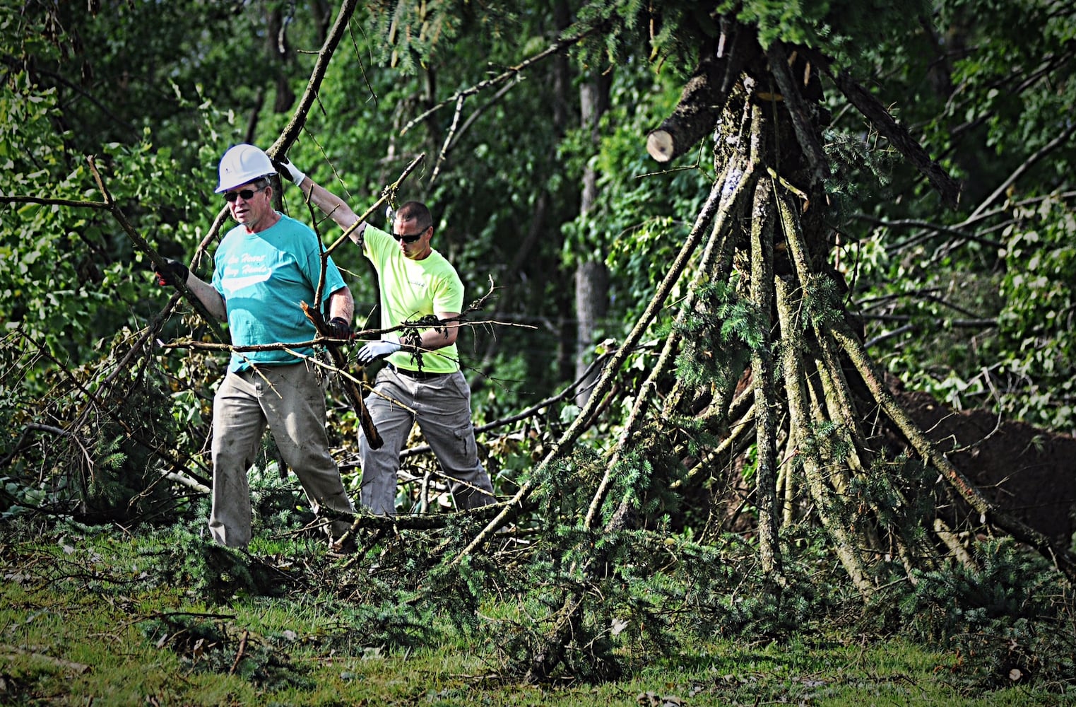 PHOTOS: Tornado-damaged communities dig out, clean up