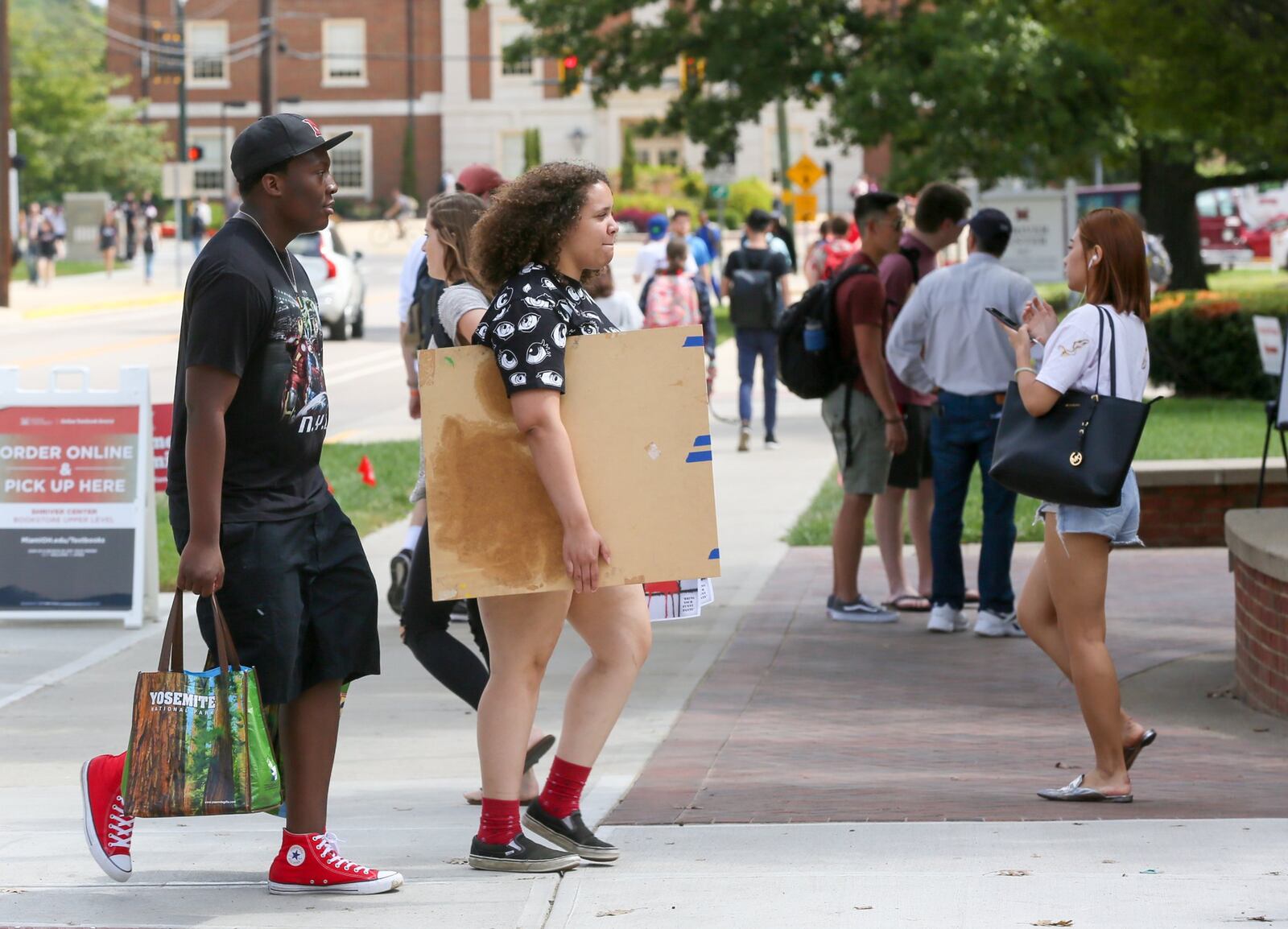 Students walk between class periods on the campus of Miami University in Oxford, Wednesday, Aug. 30, 2017. GREG LYNCH / STAFF