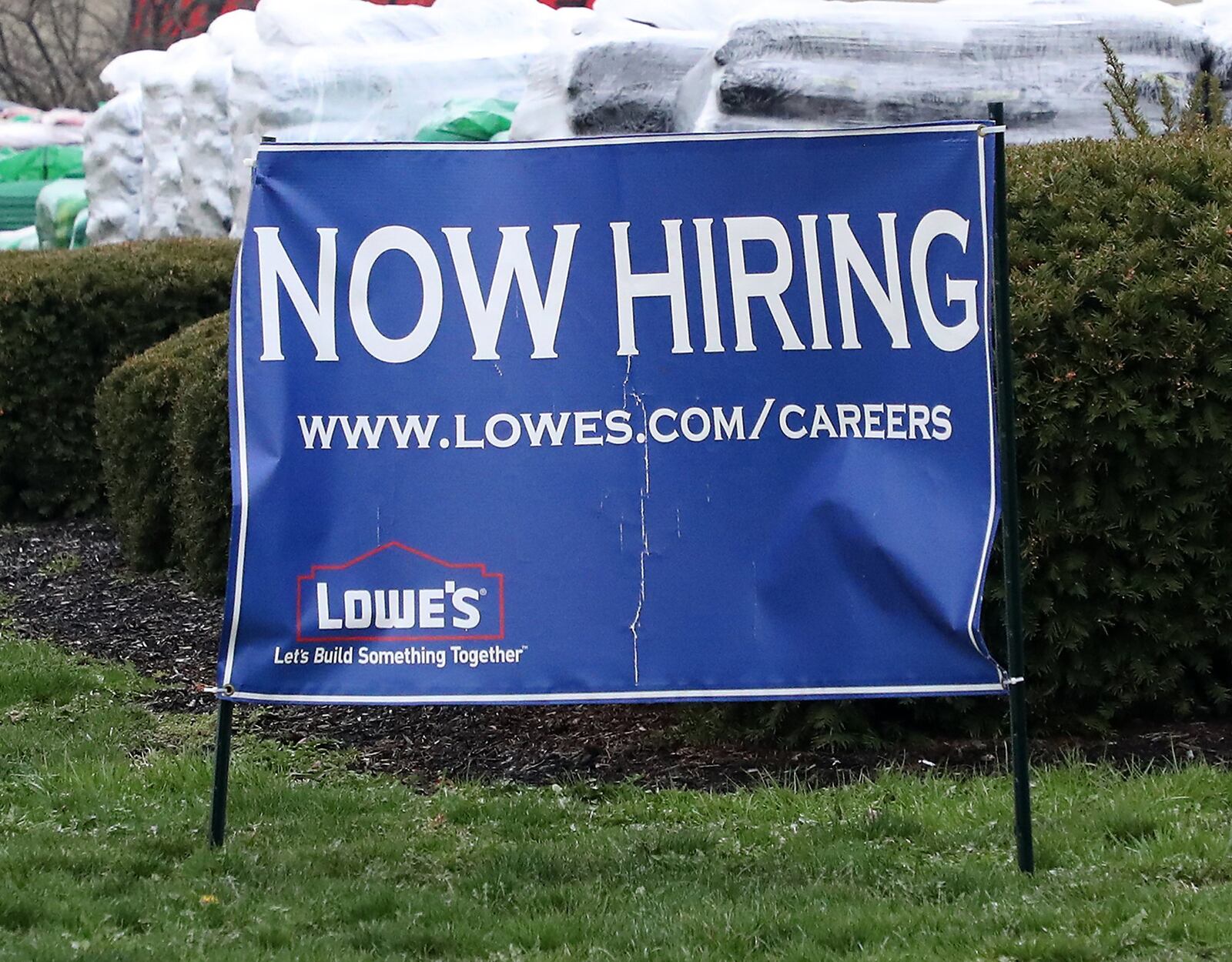 Lowe’s in Springfield has a Now Hiring sign along Bechtle Avenue. BILL LACKEY/STAFF