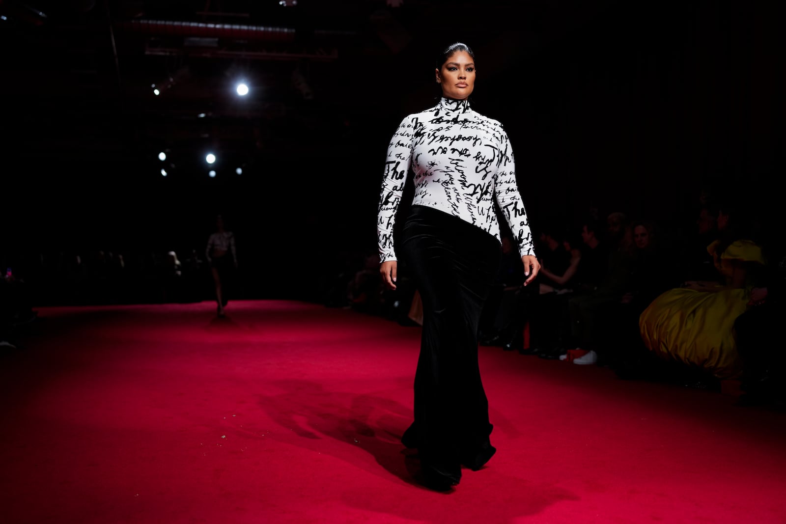 A model walks the runway during the Christian Siriano Fall/Winter 2025 fashion show at Chelsea Industrial during New York Fashion Week on Thursday, Feb. 6, 2025, in New York. (Photo by Charles Sykes/Invision/AP)