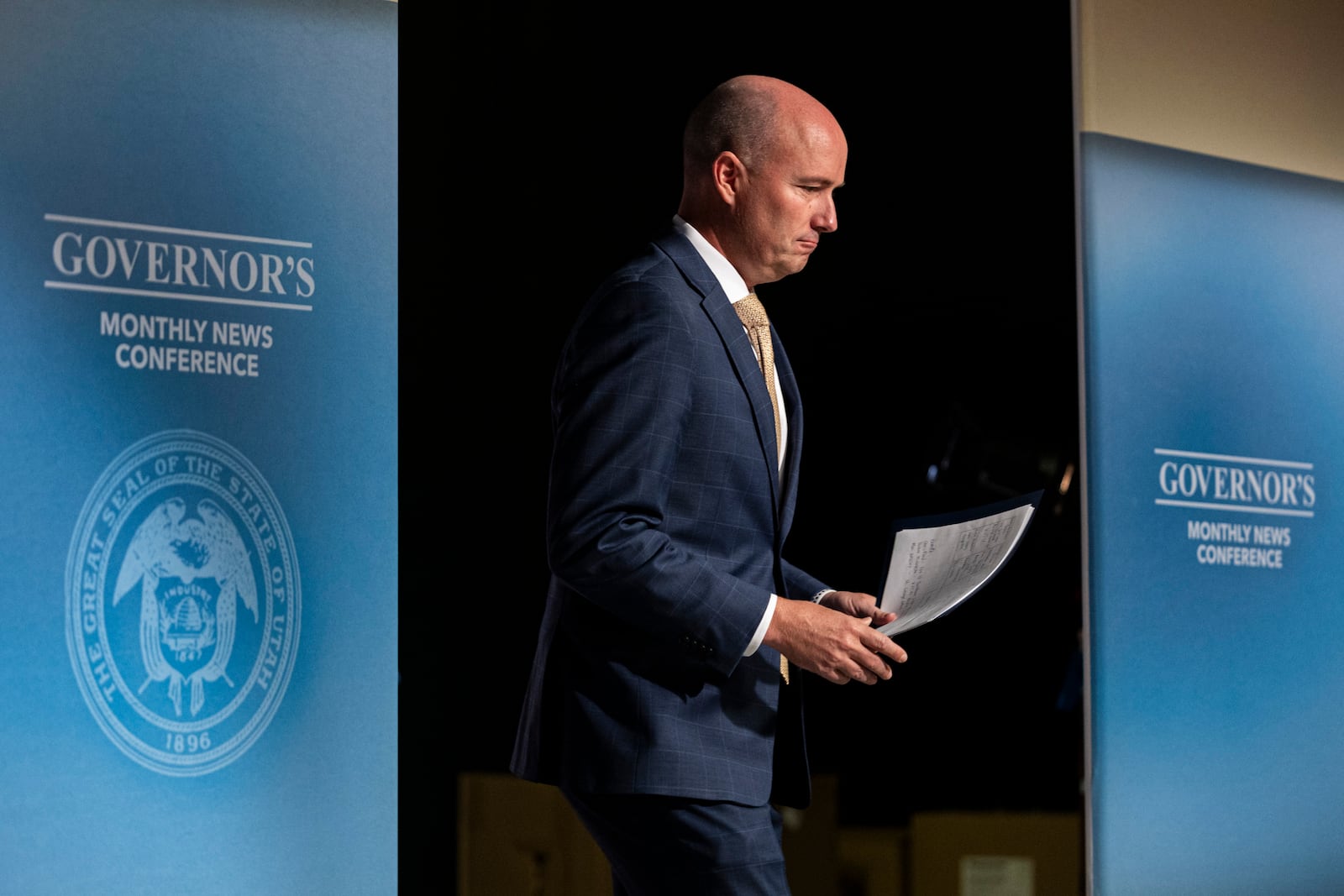 Utah Gov. Spencer Cox enters his monthly news conference held at the Eccles Broadcast Center in Salt Lake City, Thursday, Sept. 19, 2024. (Isaac Hale/The Deseret News via AP, Pool)