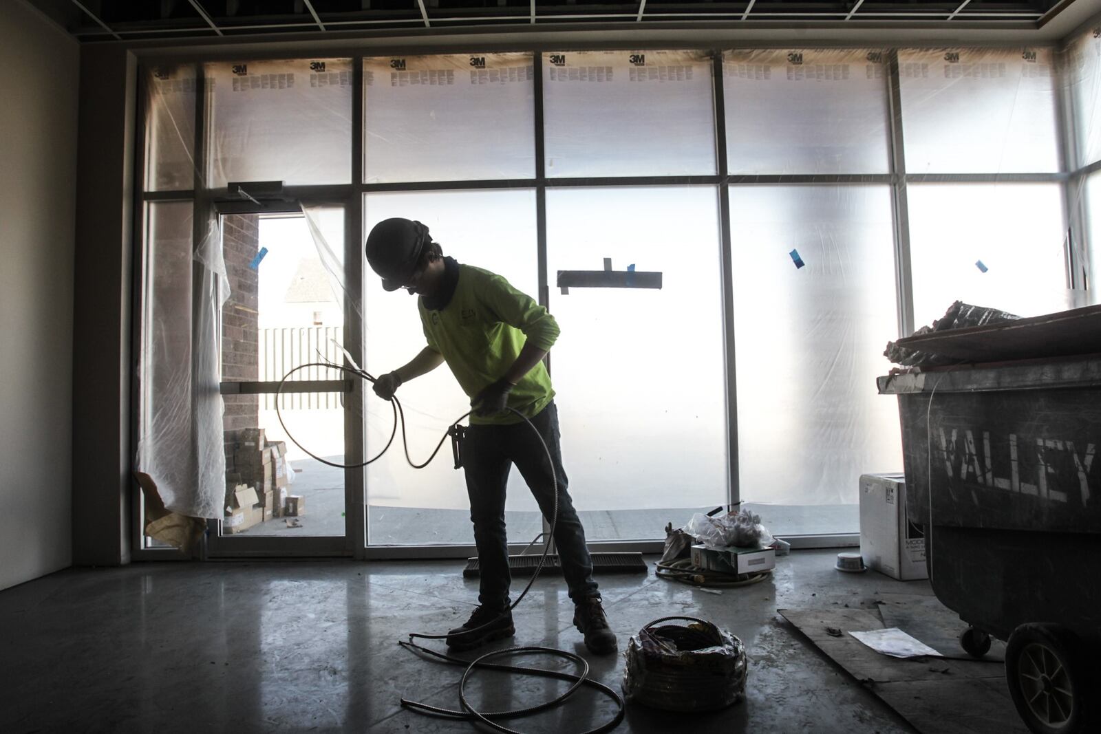 Electrician, Austin Moore, cuts wire at the Gem City Market Friday Jan. 29, 2021. Seven months of job growth in the Dayton region came to an end in December, which was a setback for a labor market that still faces a long road back to pre-pandemic employment levels. JIM NOELKER/STAFF